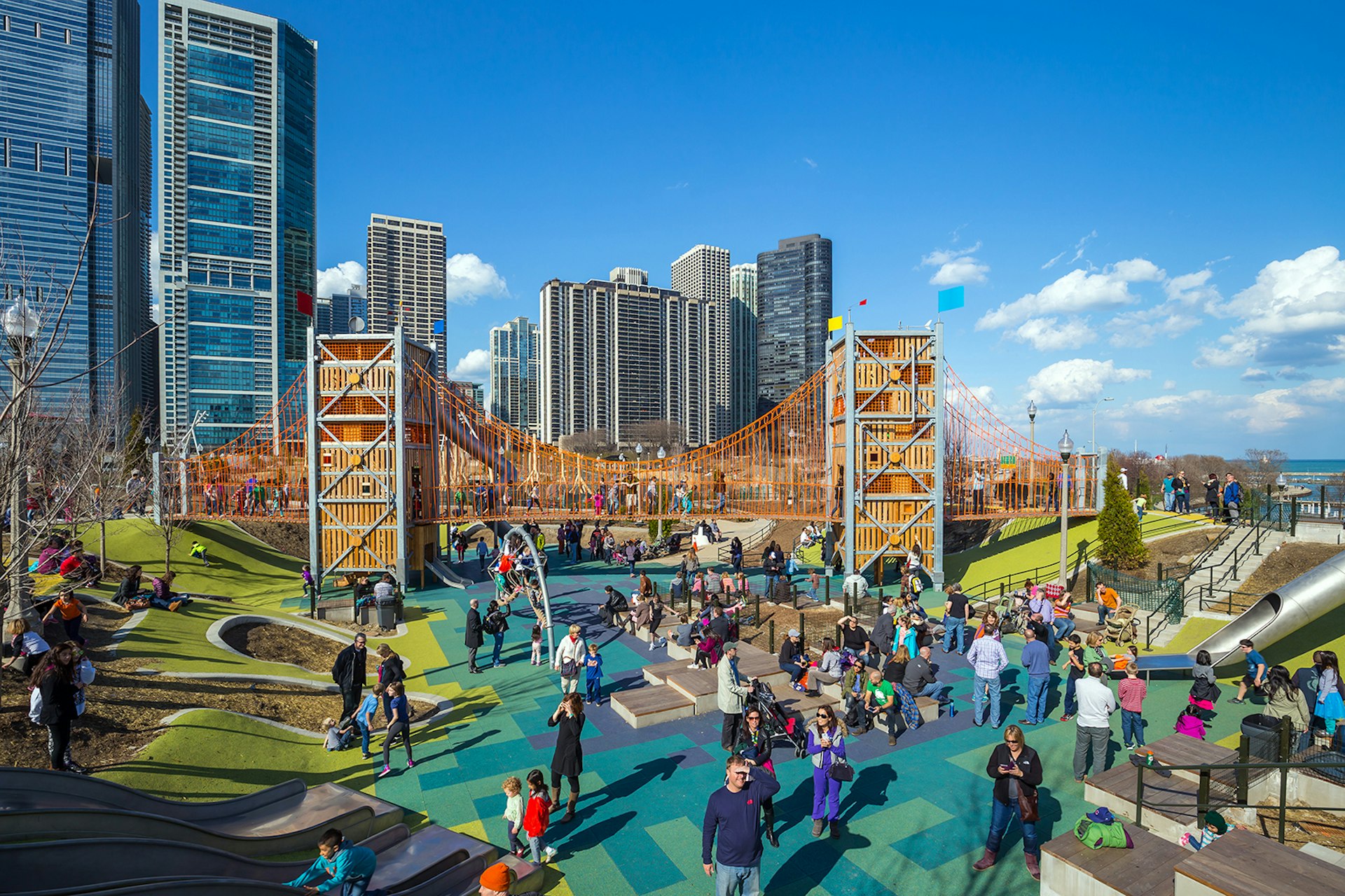 Families gather on the colorful playground at Maggie Daley Park in downtown Chicago