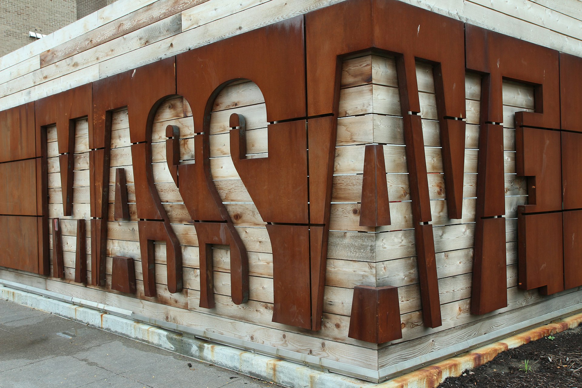 close up of industrial style neighborhood sign for Mass Ave in Indianapolis