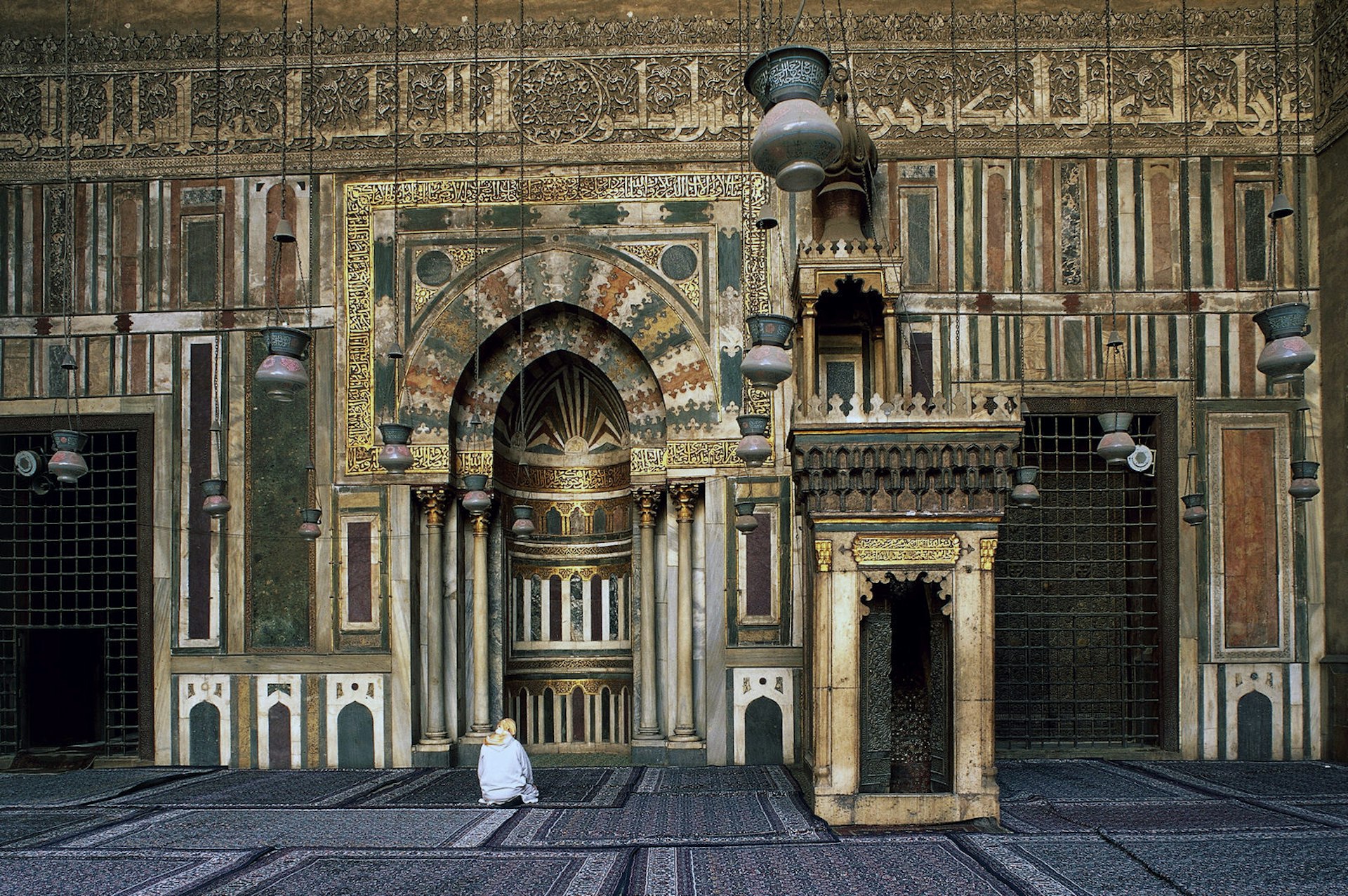 The 14th-century mihrab and minbar in the prayer hall of the Mosque-Madrassa of Sultan Hassan, Cairo, Egypt. Image by De Agostini / S. Vannini / Getty Images