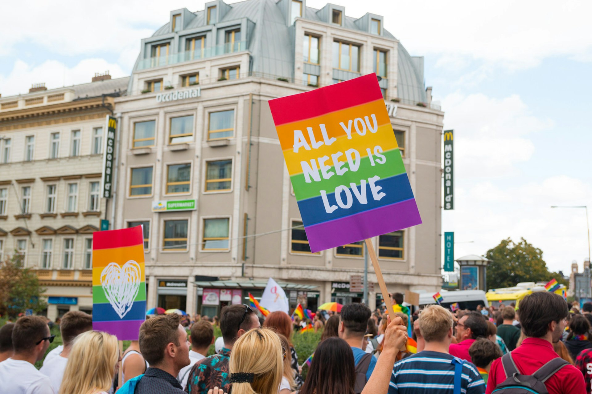 Pride in Europe: A Pride festival crowd in Prague, one banner reads: 'All you need is love' © Tatiana Dyuvbanova / Shutterstock