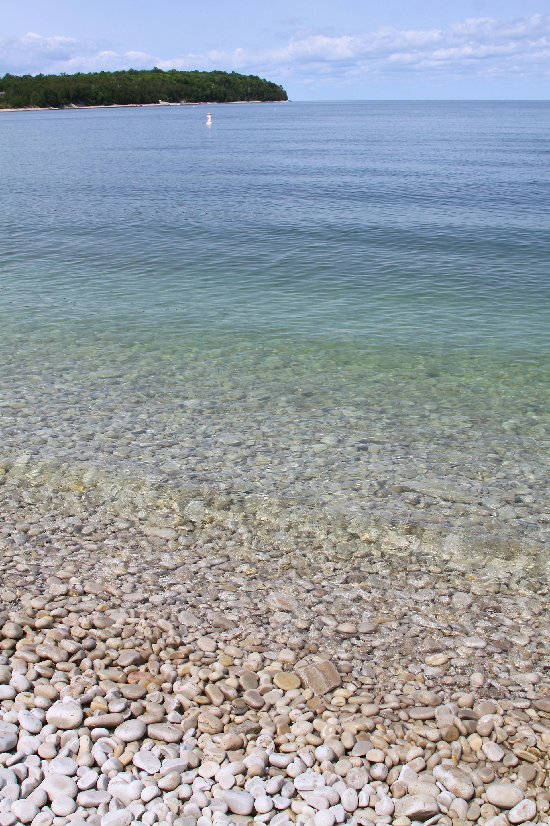 small limestone rocks and clear waters of Lake Michigan on Schoolhouse Beach