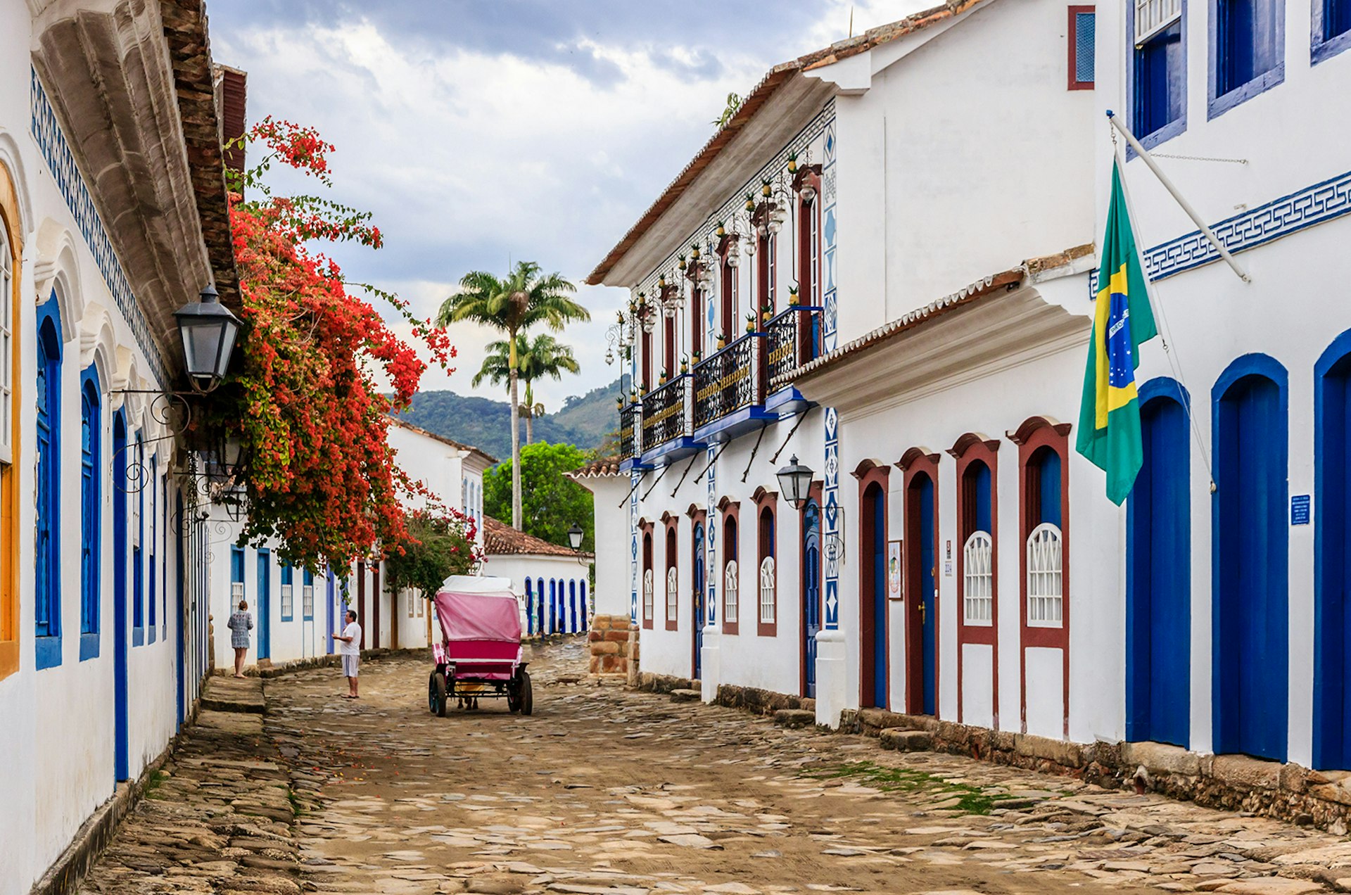 A carriage drives down a cobblestone street in Paraty