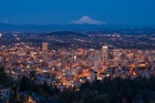 Downtown Portland at dusk from Pittock Mansion, with Mount Hood in the background © Piriya Photography / Getty Images
