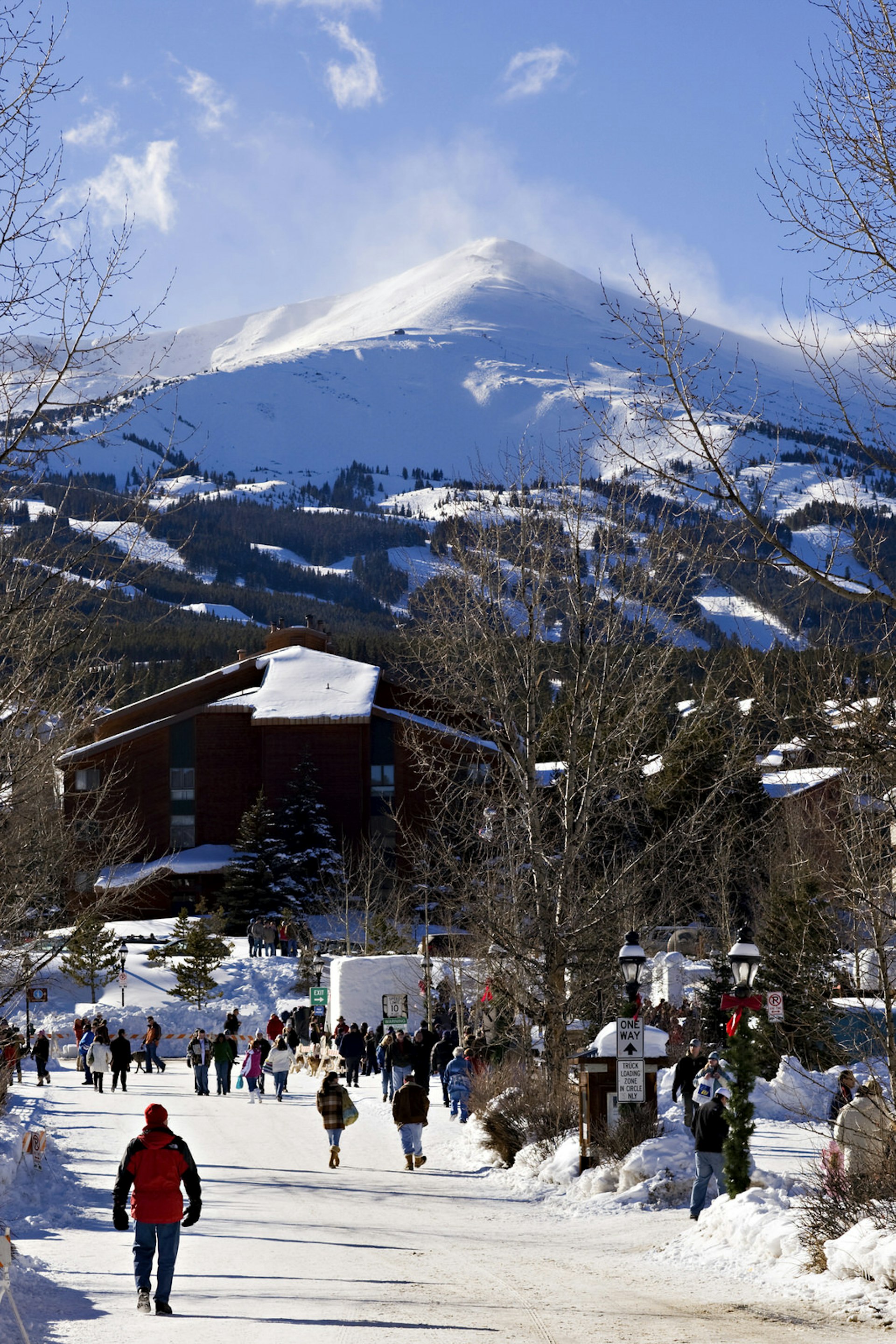 A small, snow covered mining town is shown with the backdrop of a stunning and huge mountain © Wesley Hitt / Getty Images