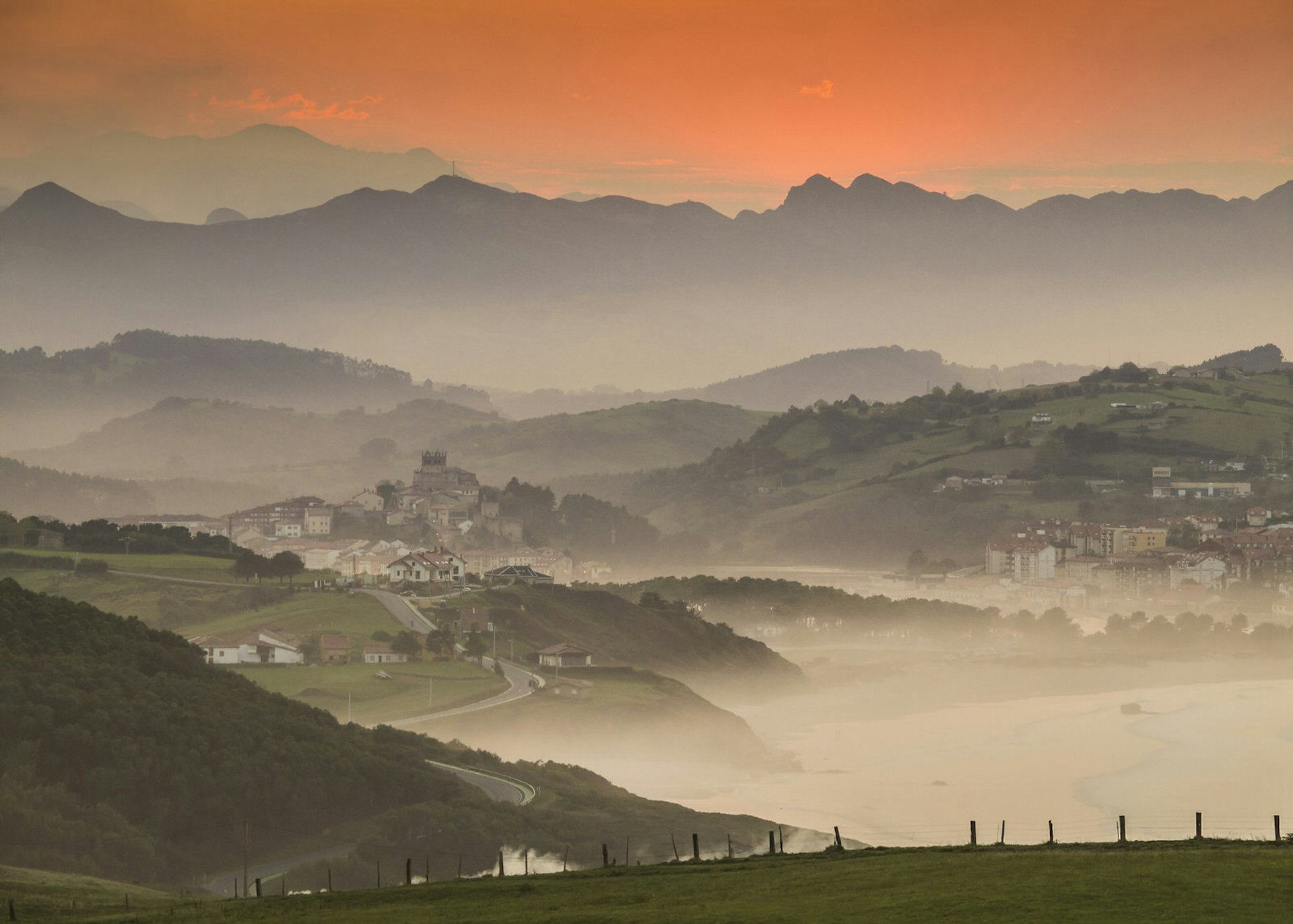 Mist rises as the sun sets on San Vicente de la Barquera, one of Cantabria's many picturesque towns © Javier Fernández Sánchez / Getty Images