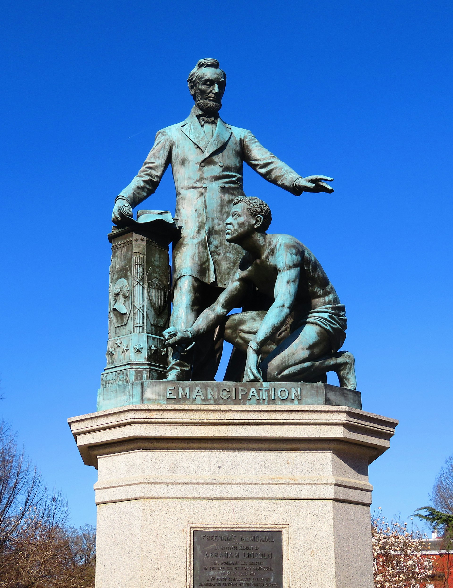 patinaed bronze sculpture of Abraham Lincoln with a kneeling emancipated slave in Washington DC