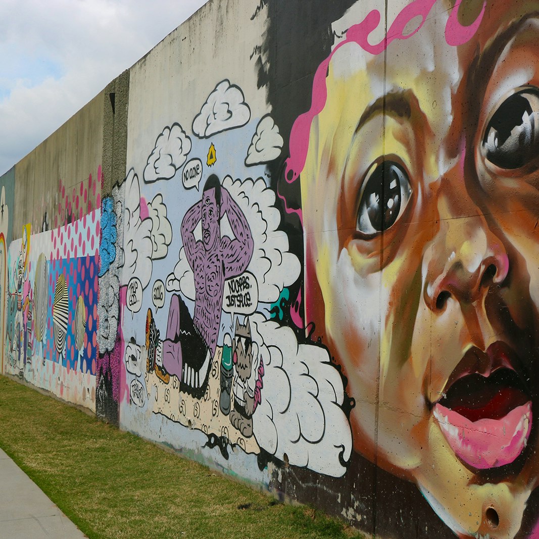 mural with image of child against a colorful background