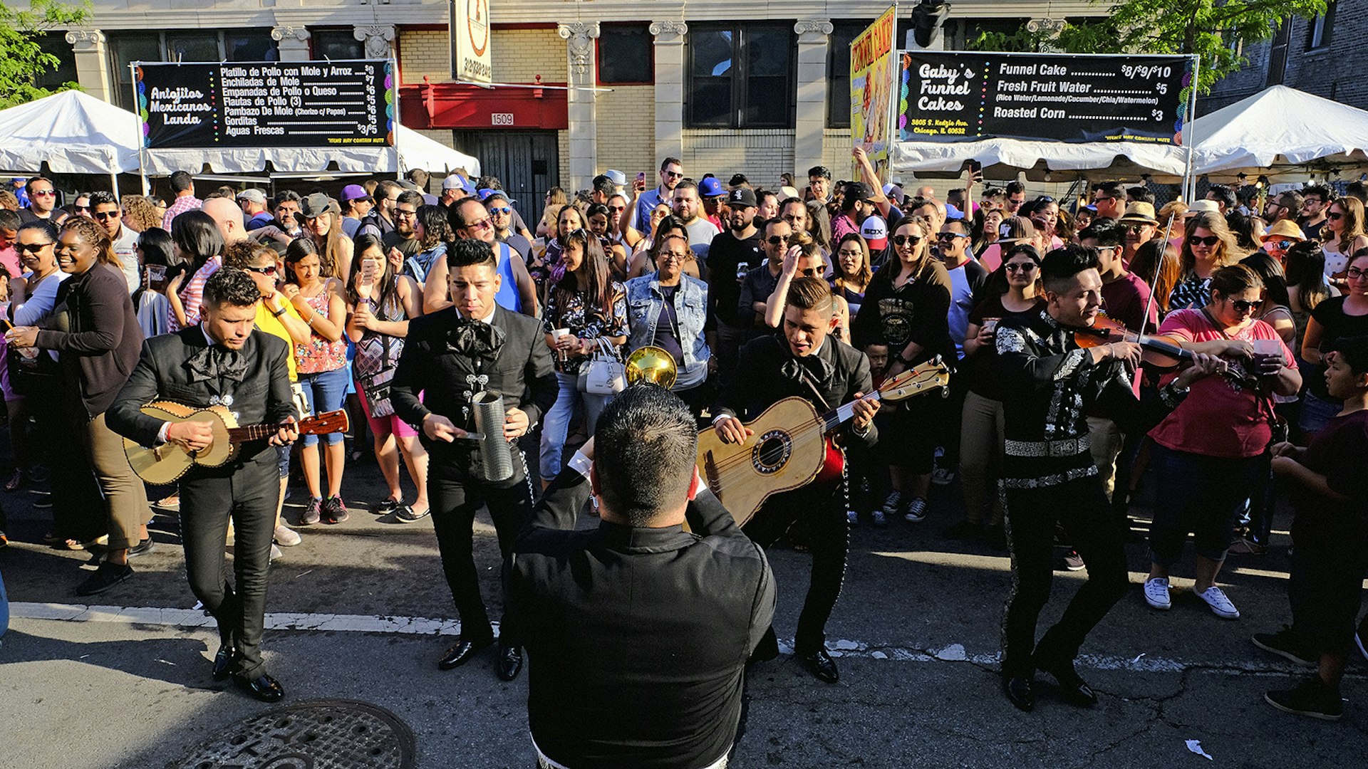 mariachi band performs in the streets in Chicago during Mole Fest