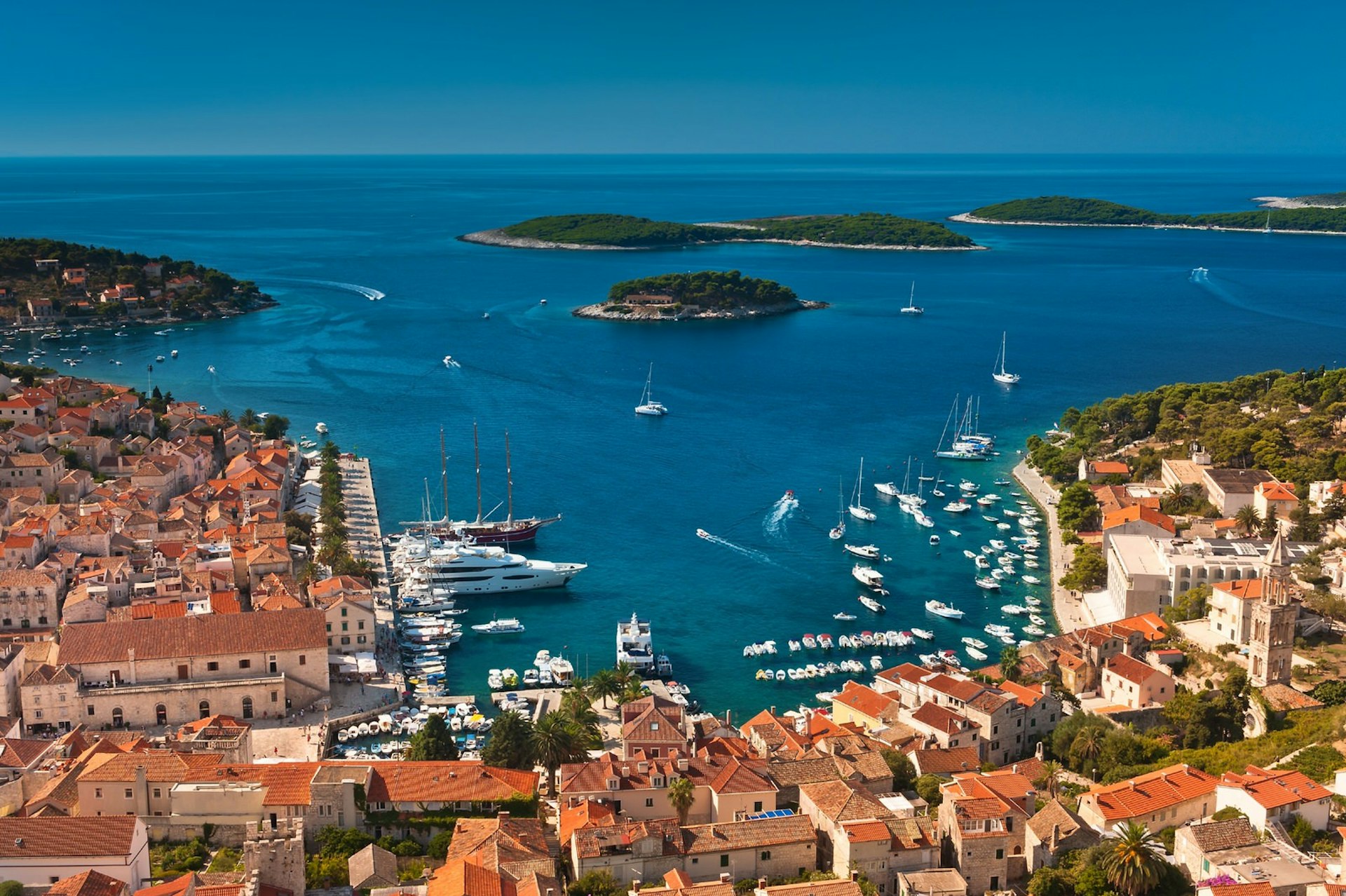 A view from above of Hvar Town's square harbour, with the Pakleni Islands in the distance © Evgeniya Moroz / Shutterstock