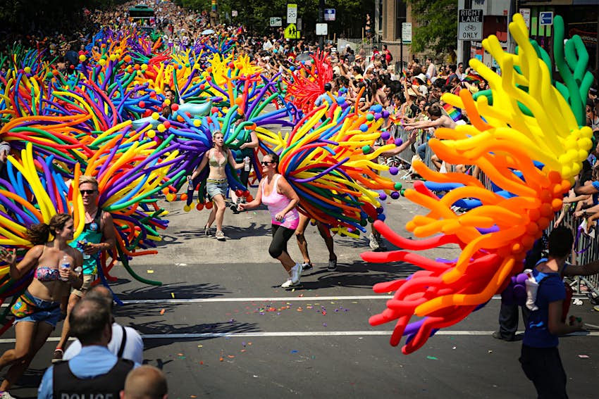 Features - shutterstock_105962462_1-de0223cd3086 Pride in the US: Chicago Pride parade – women walk in colourful costumes © Cafebeanz Company / Shutterstock