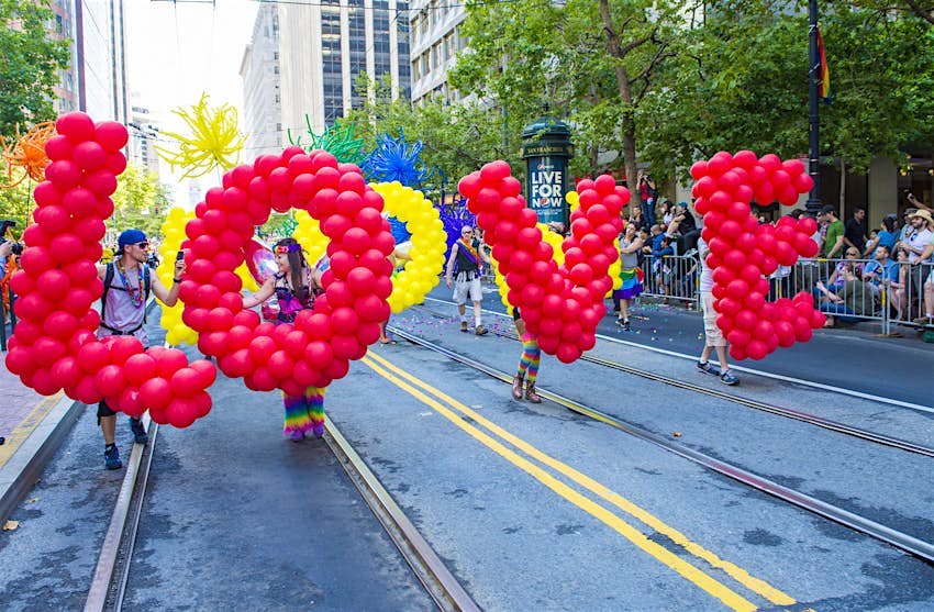 Pride in the US: Parade participants carry balloons to spell out 'LOVE' © Kobby Dagan / Shutterstock