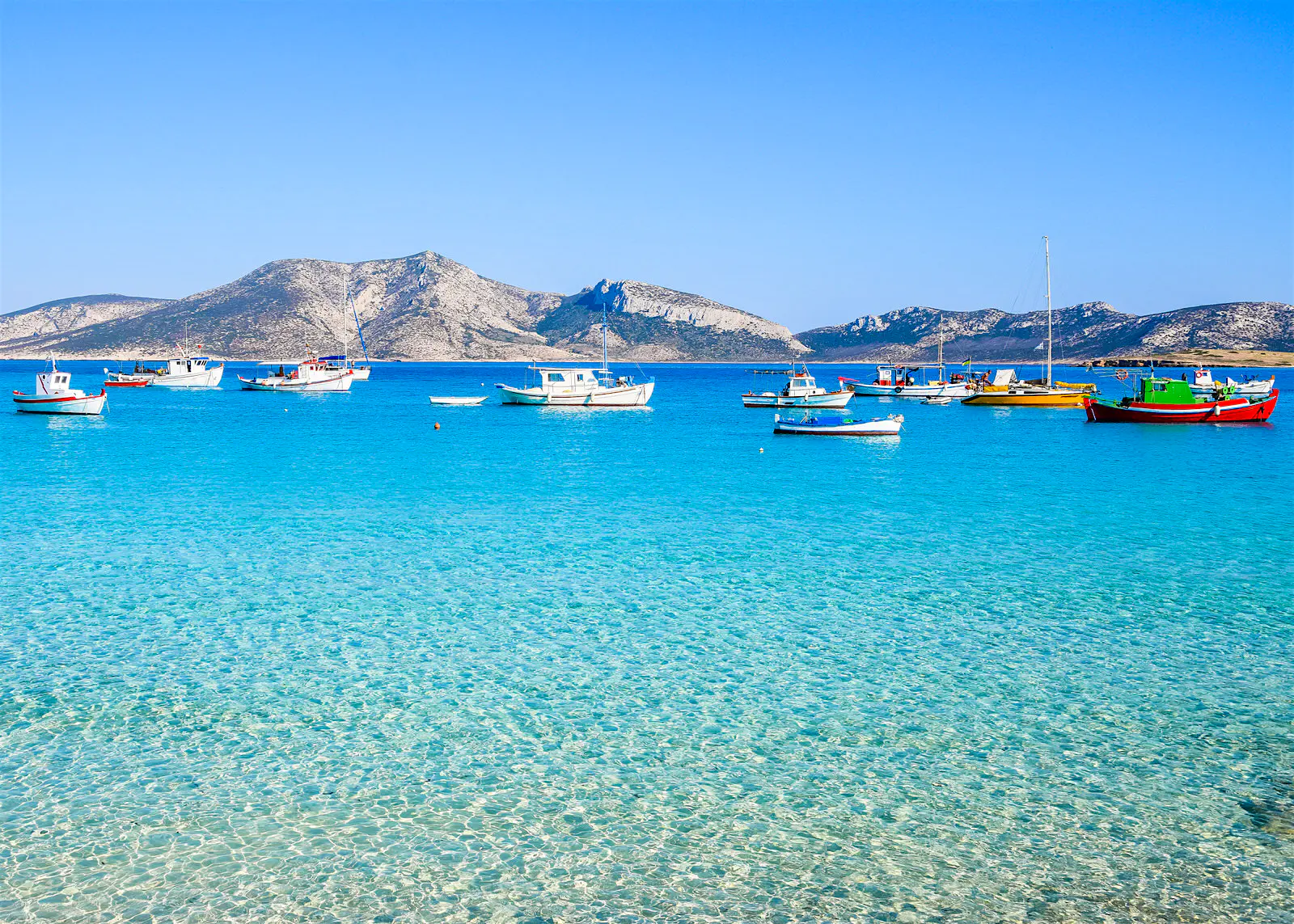 Features - smallcyclades-dad14170c202 Traditional fishing boats bob in the shallows of Koufonisia, the best-known of the Small Cyclades © Nicole Kwiatkowski / Shutterstock