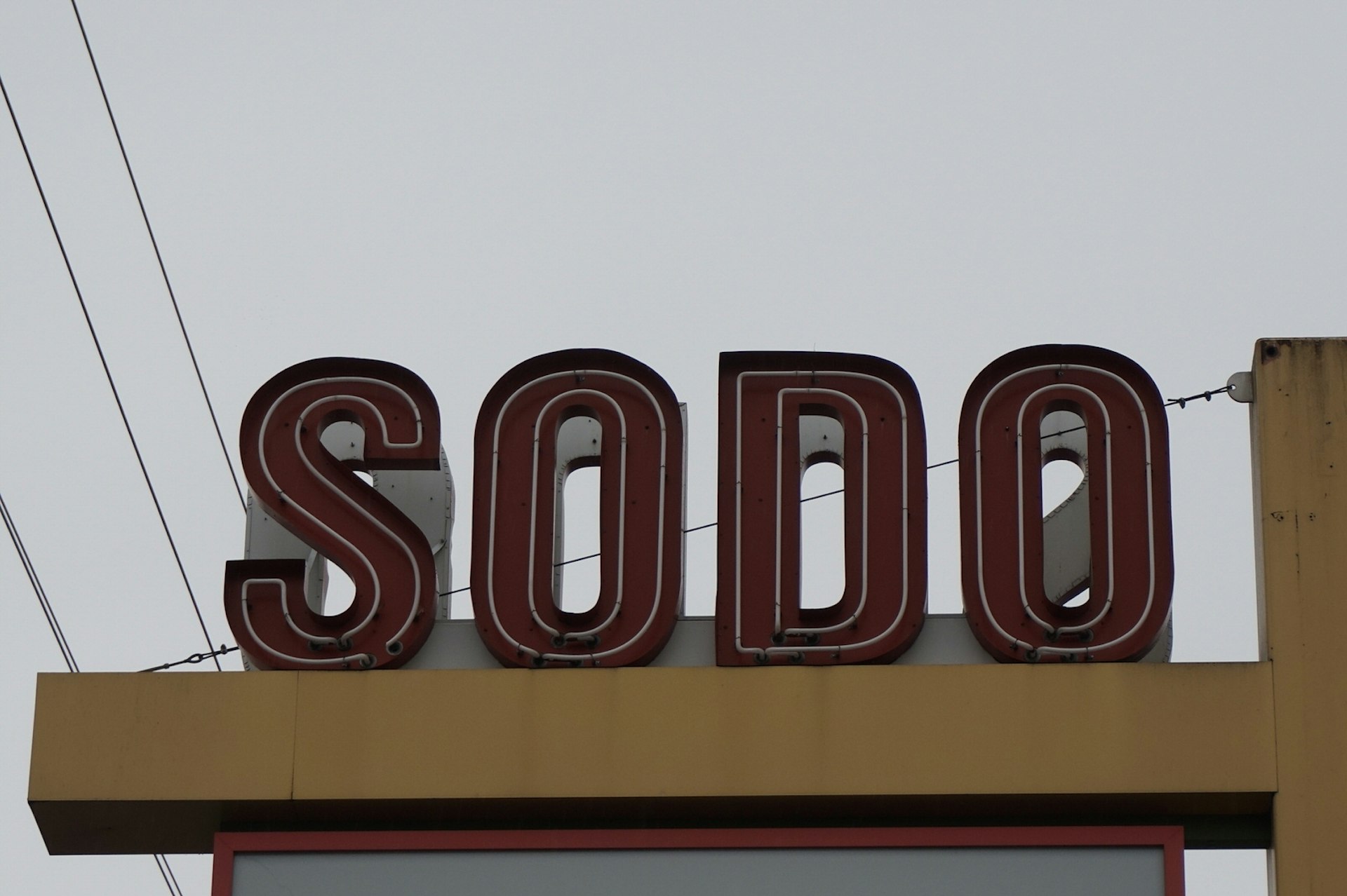 The yellow and red sign for the SoDo district in Seattle© Brendan Sainsbury / Lonely Planet 