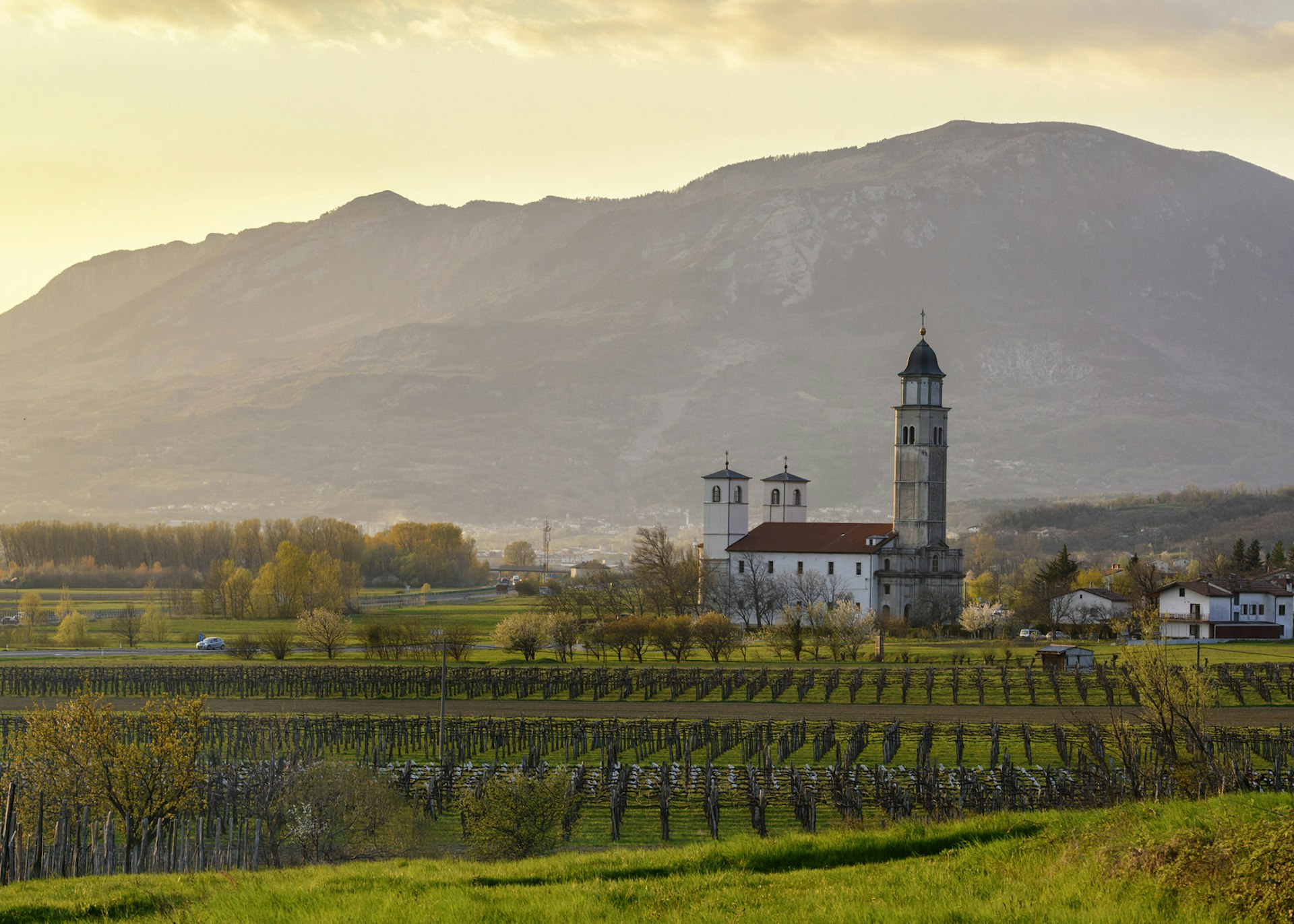 A church at dusk in Slovenia's Vipava Valley © Mny-Jhee / Getty Images