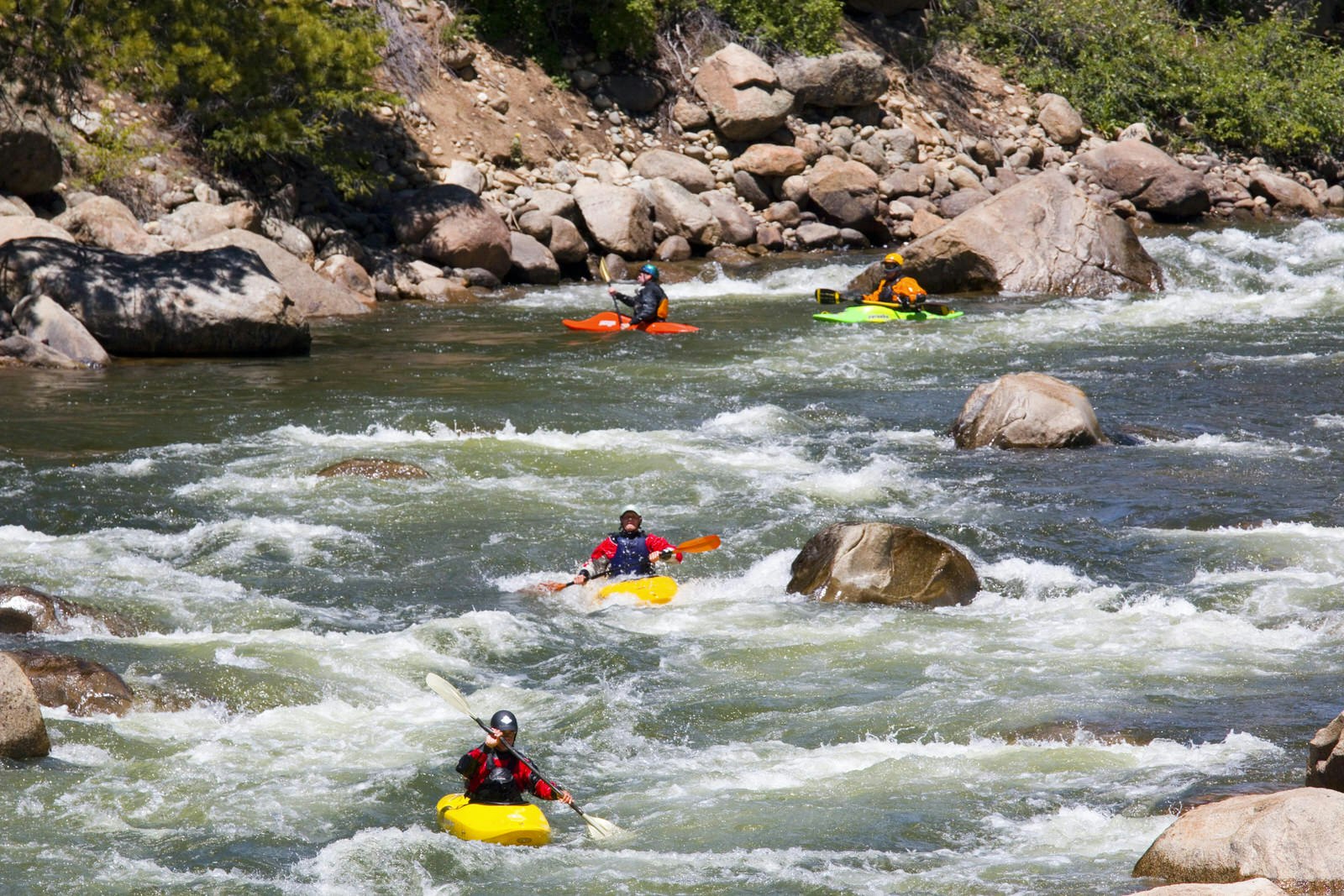 A caravan of whitewater rafts bobs down the Arkansas river in Colorado © Getty Images
