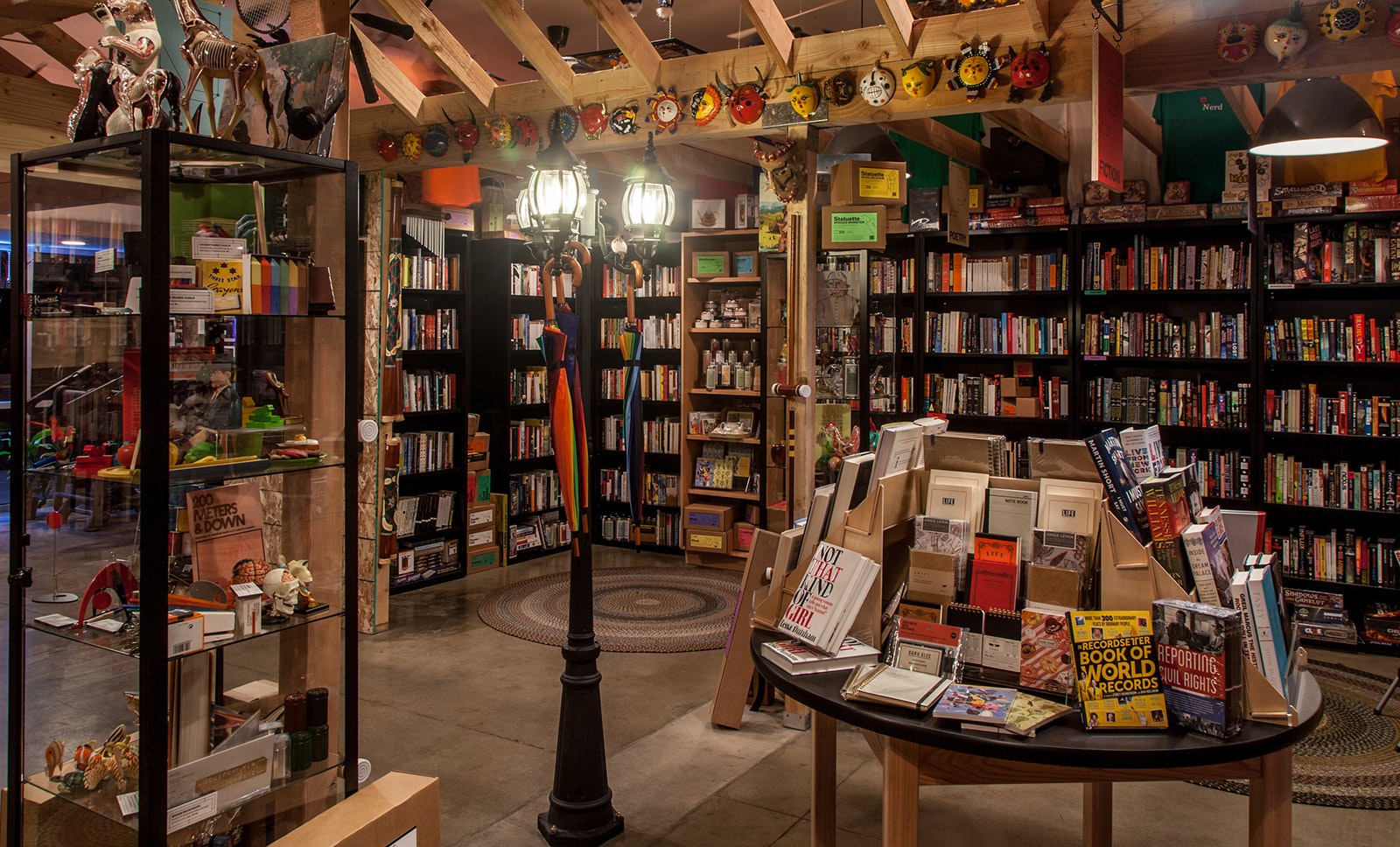 interior shot of bookshop with loaded bookshelves and lamp post
