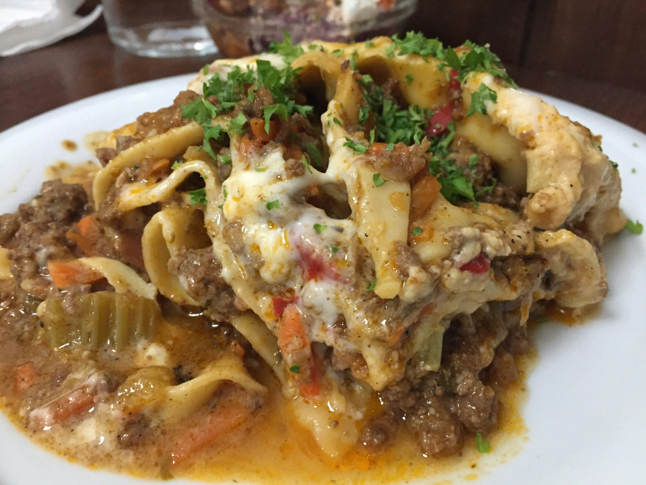 Close-up of a steaming plate of homemade lasagne at Café Rouge © Violetta Teetor