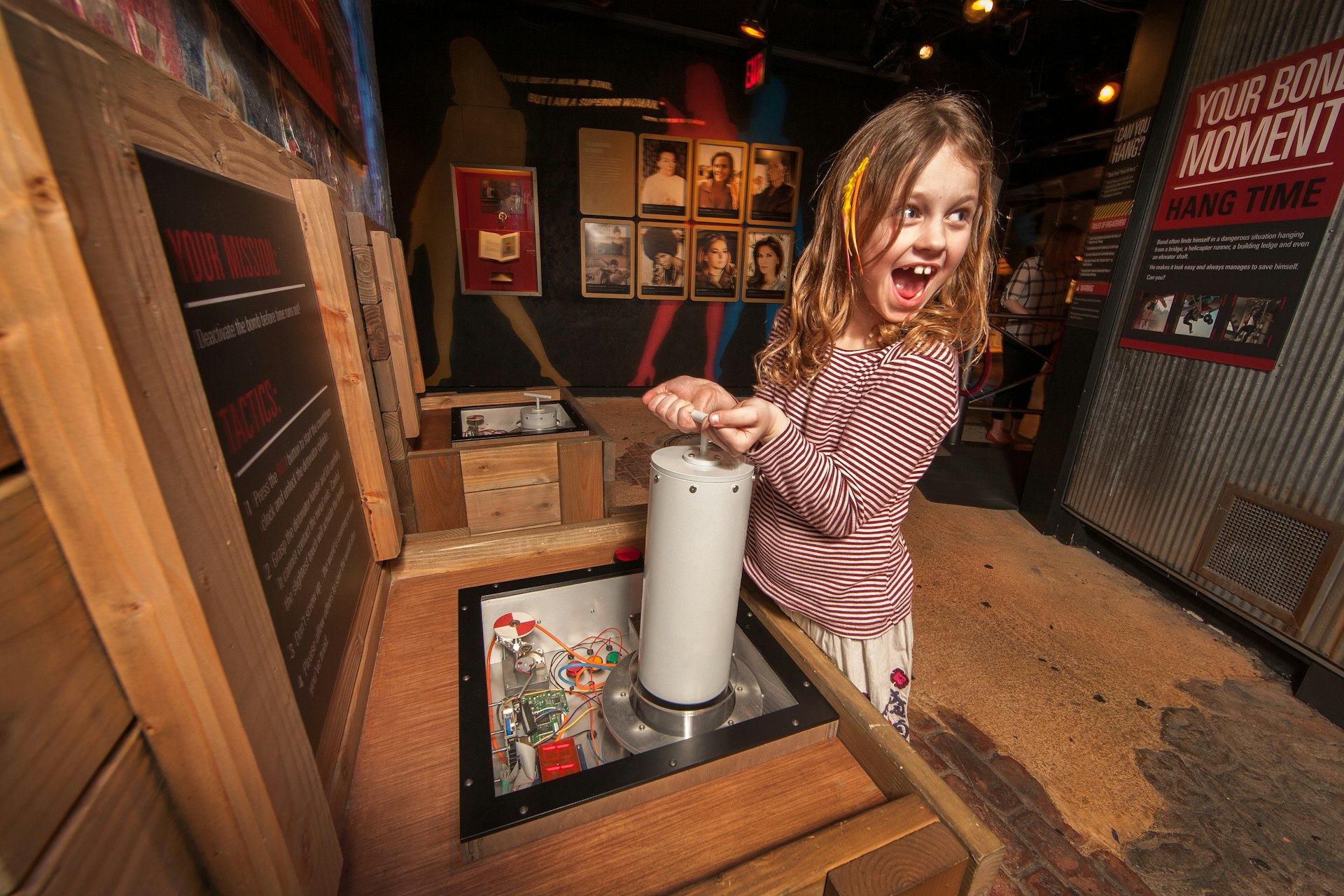 Excited girl experiments with spy equipment at the International Spy Museum © International Spy Museum