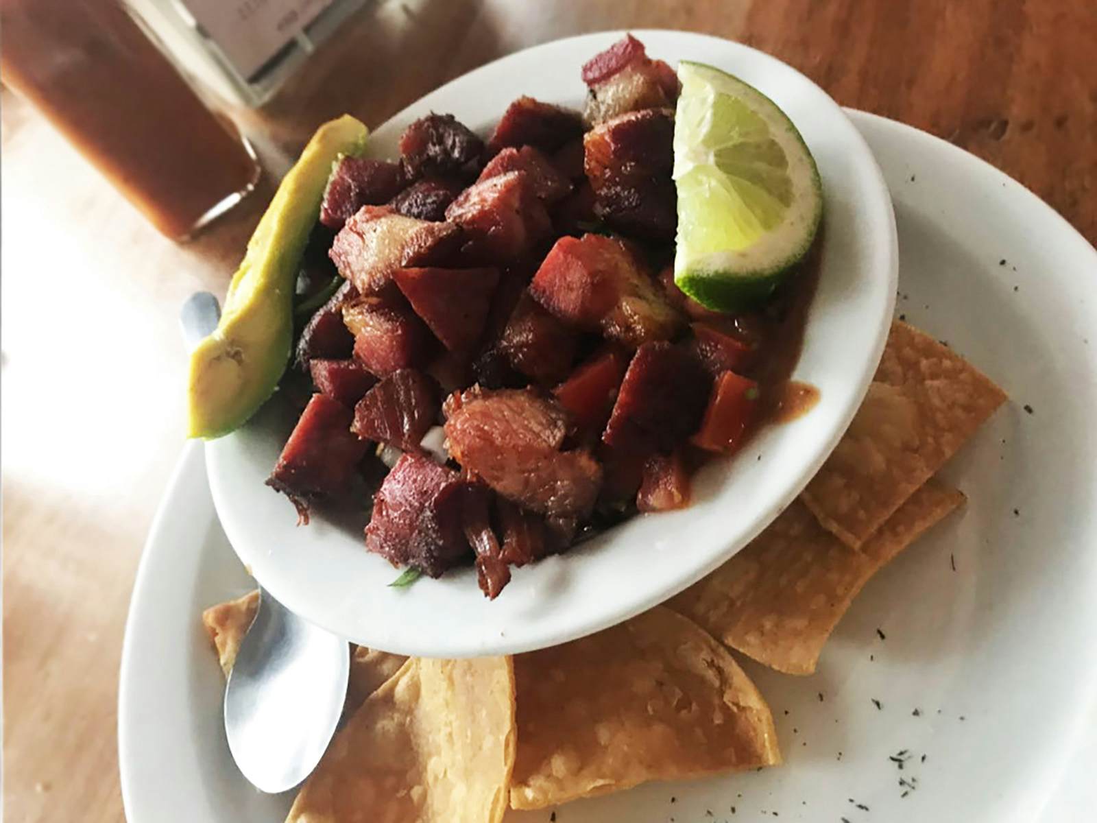 Chifrijo is a typical Costa Rican dish made with pork, beans, rice and pico de gallo and is a popular dish at La Oveja Negra Restaurant Maria Esther Abissi / Lonely Planet