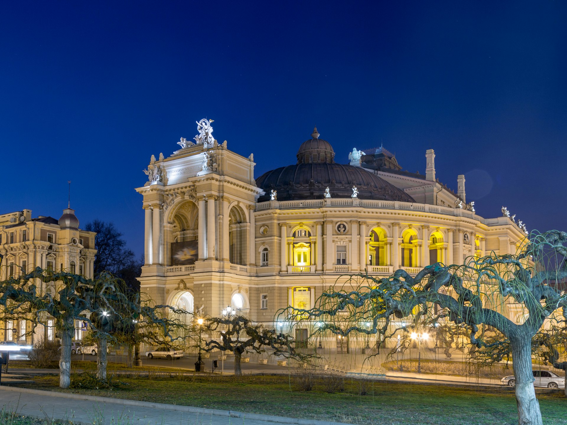 The building of Odesa Opera and Ballet Theatre lit up at night