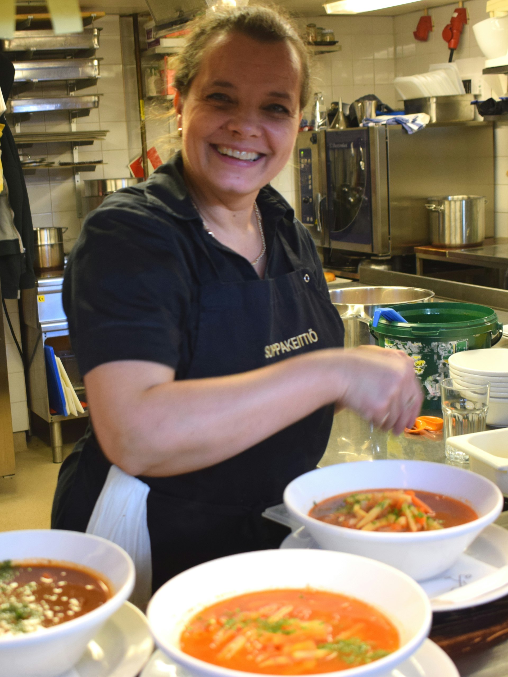 Chef Paula beams with pride as she serves up Soppakeittiö's soup © Violetta Teetor