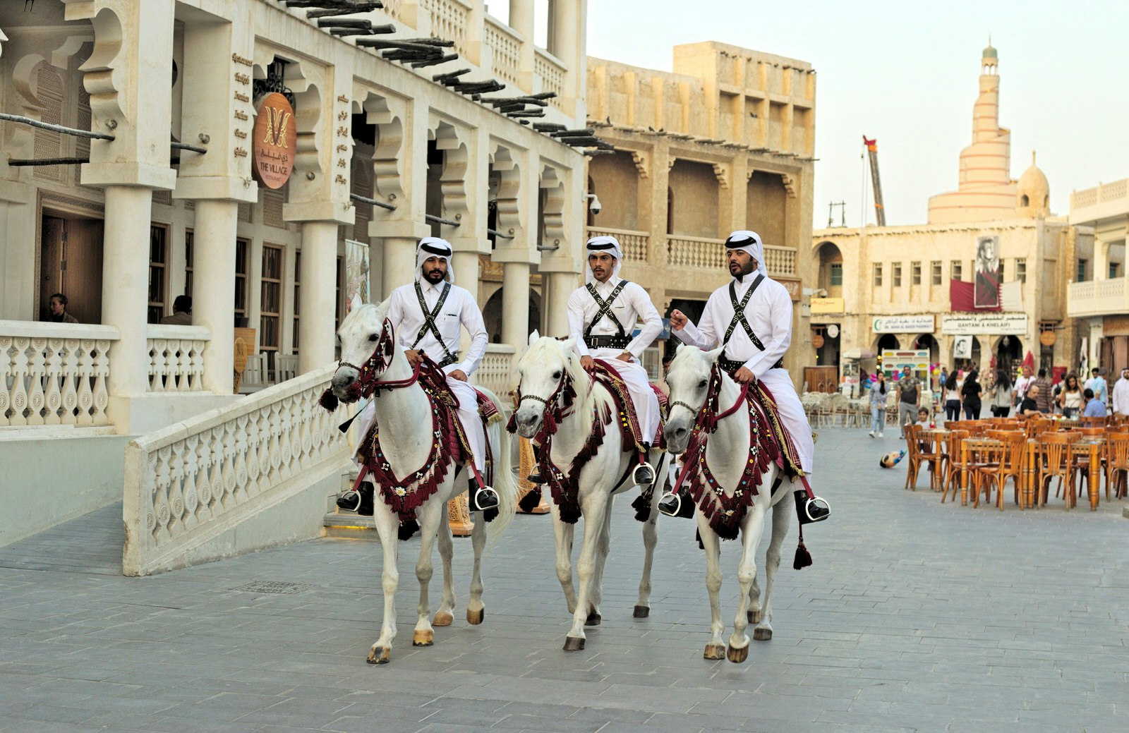 Mounted police patrol the main thoroughfare of Souq Waqif market in Doha, Qatar © Paul Cowan / Shutterstock