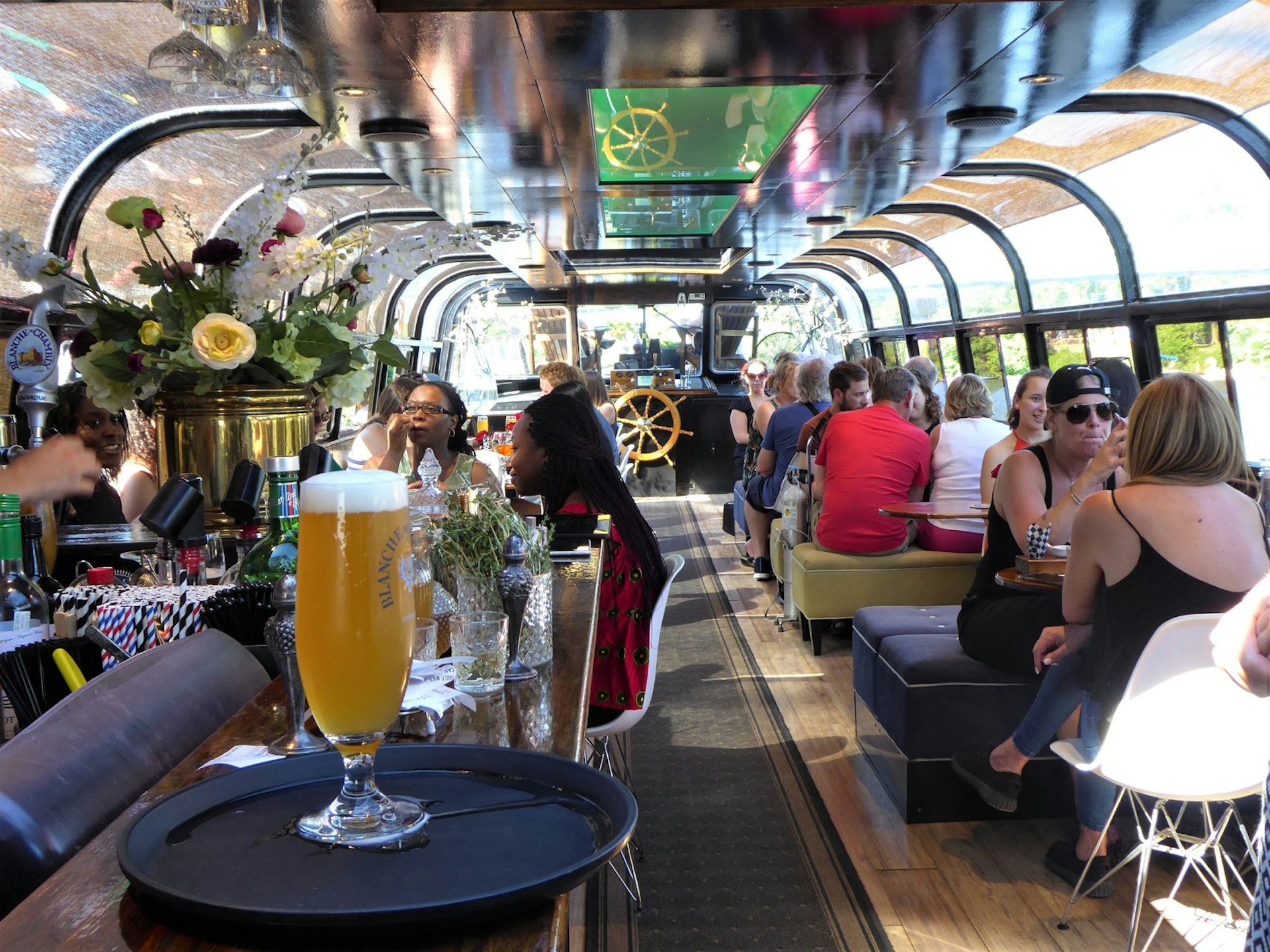 The interior of a restaurant in Montreal, in a glass-walled canal barge © Jason Najum / Lonely Planet