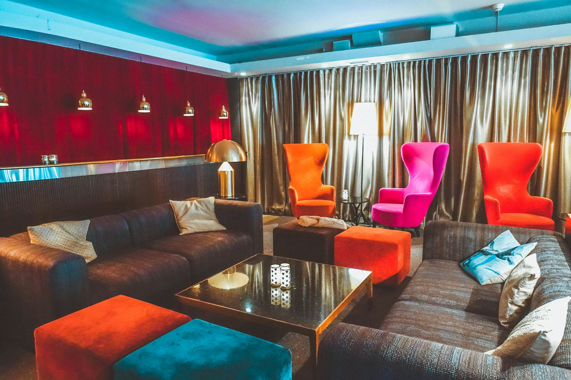 Interior shot of Hotel Rival, showing the colourful, plush furniture in the lounge area © Megan & Whitney Bacon-Evans / Lonely Planet