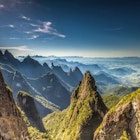 A mountain range of sharpe peaks fading into the distance © Rafael Fernando / 500px