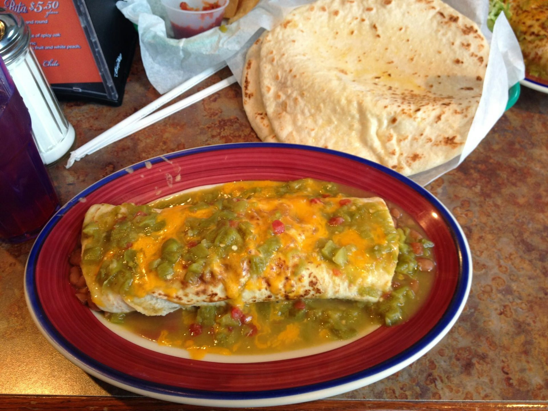 Burrito smothered in cheddar cheese and green chile at Duran's Station in Albuquerque © Megan Eaves / Lonely Planet