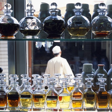 Features - Oman, Dhofar, An Omani man walks through the incense souk in Salalah.