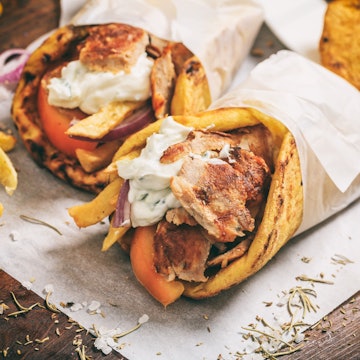 Gyros souvlaki wrapped in pita bread is the ultimate Greek snack on the go @ rawf8 / Shutterstock