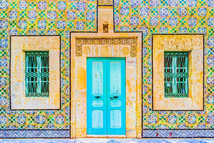 Traditional brightly painted door in the historical district or medina of Tunis, Tunisia