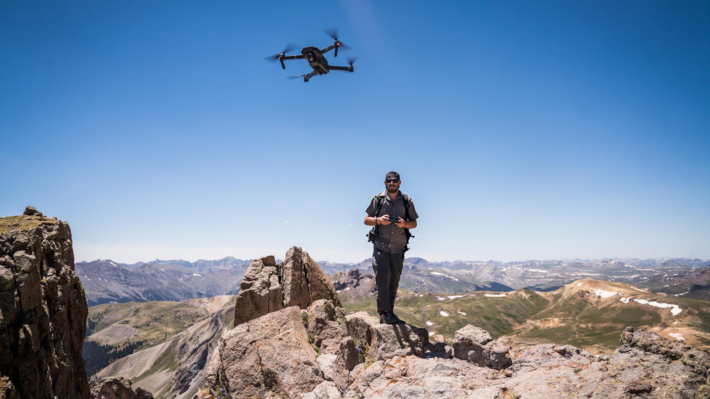 man flies a drone in Uncompagre National Forest