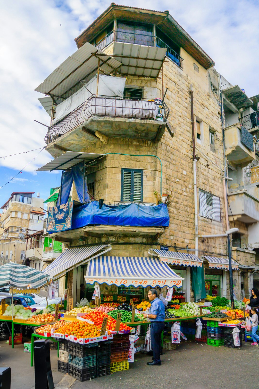 Scene of Wadi Nisnas neighbourhood and its market, with businesses, locals and tourists, in Haifa, Israel © RnDmS / Shutterstock