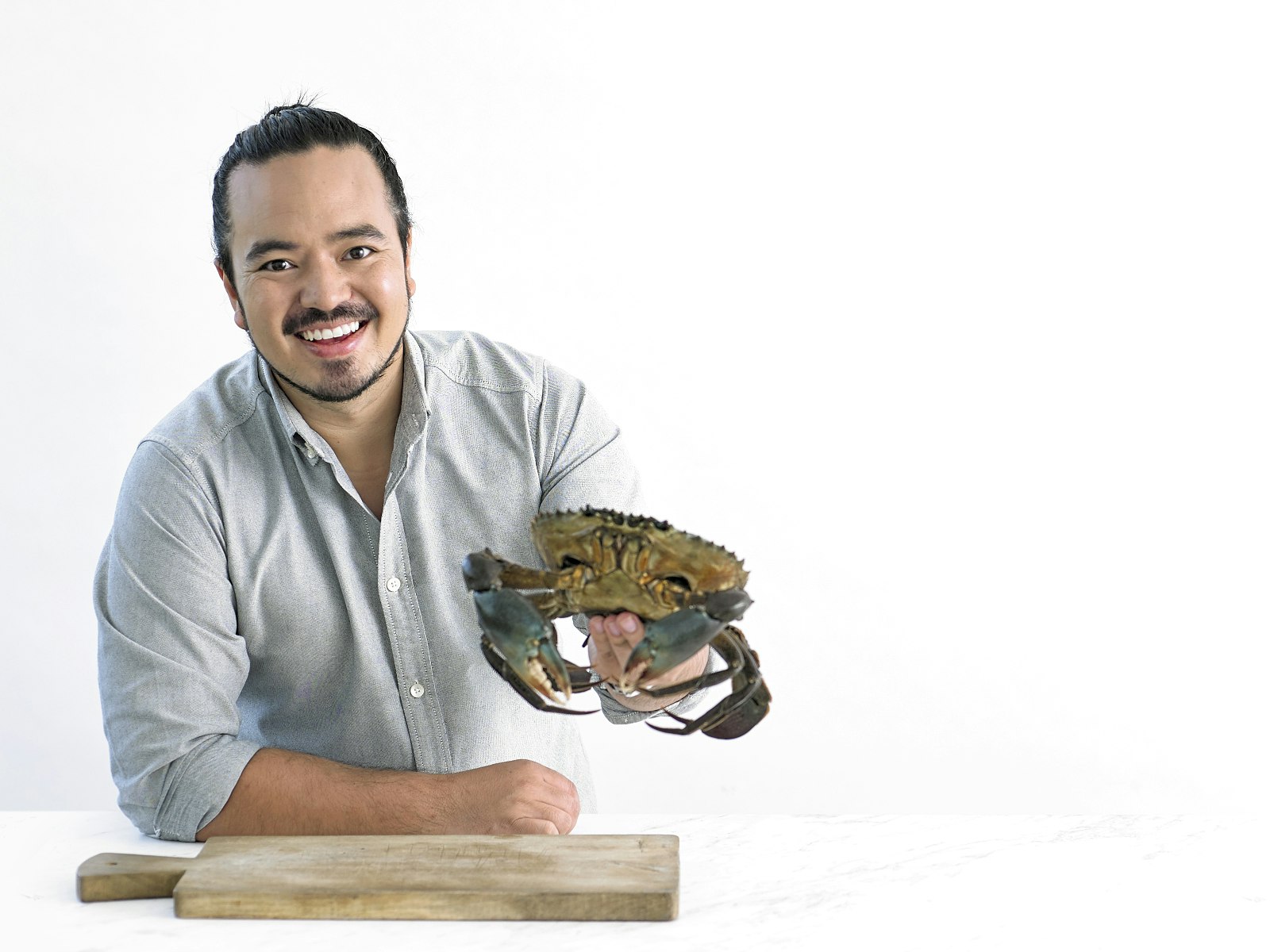 Adam Liaw holding a giant crab © Adam Liaw