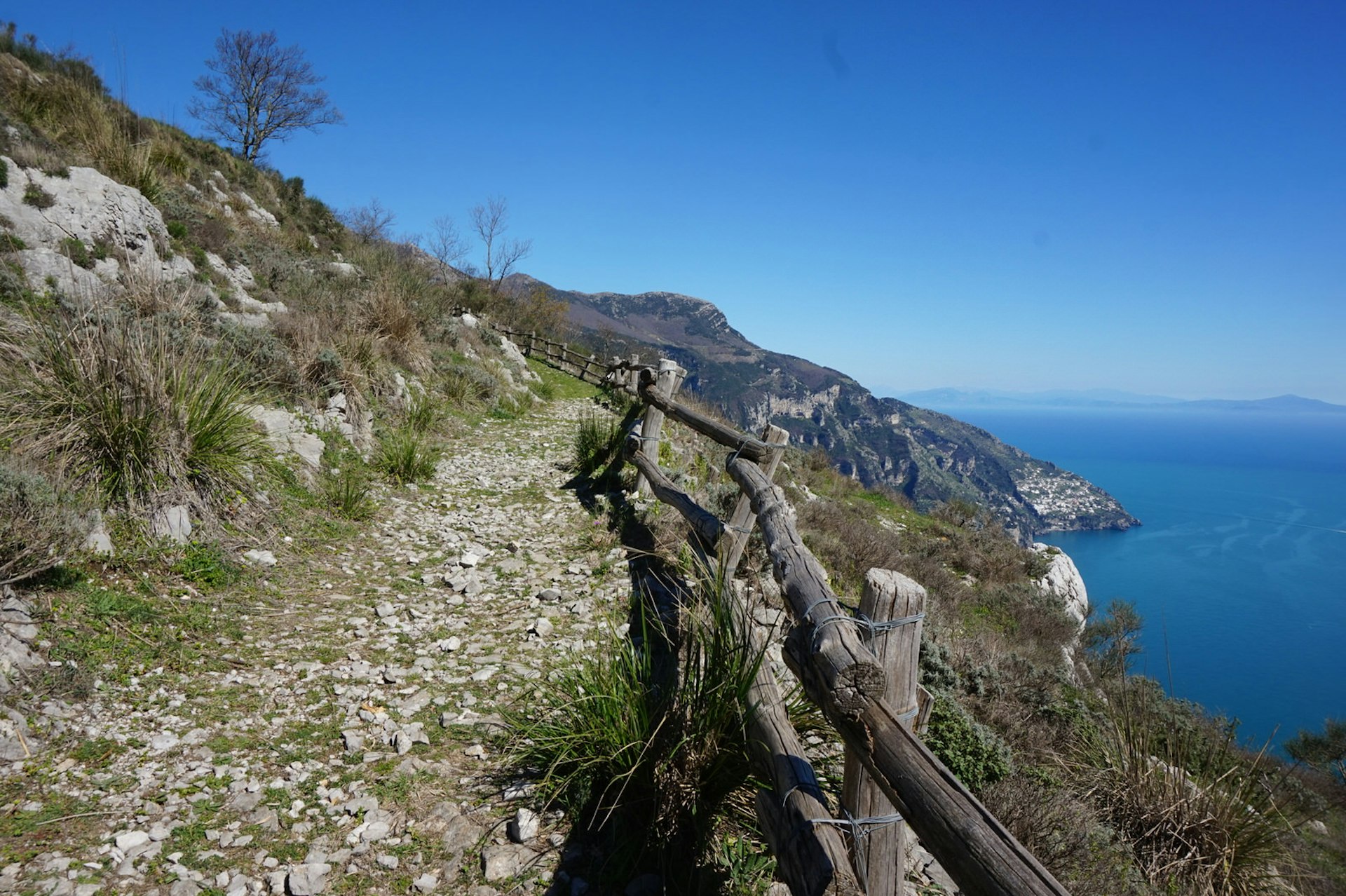 A rocky, fenced coastal path