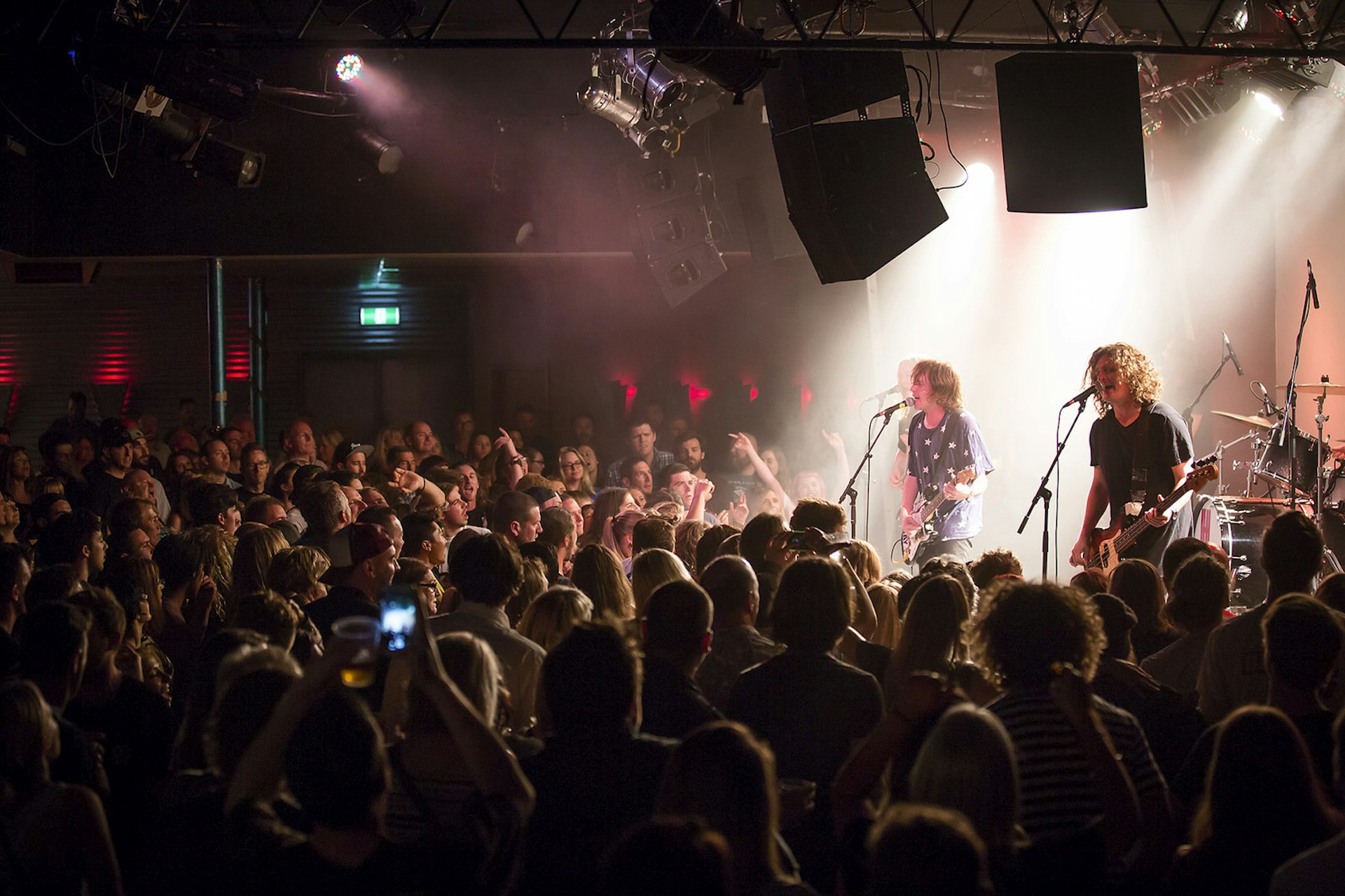 A rock band performing in front of a large crowd at The Gov in Adelaide © AK Photography