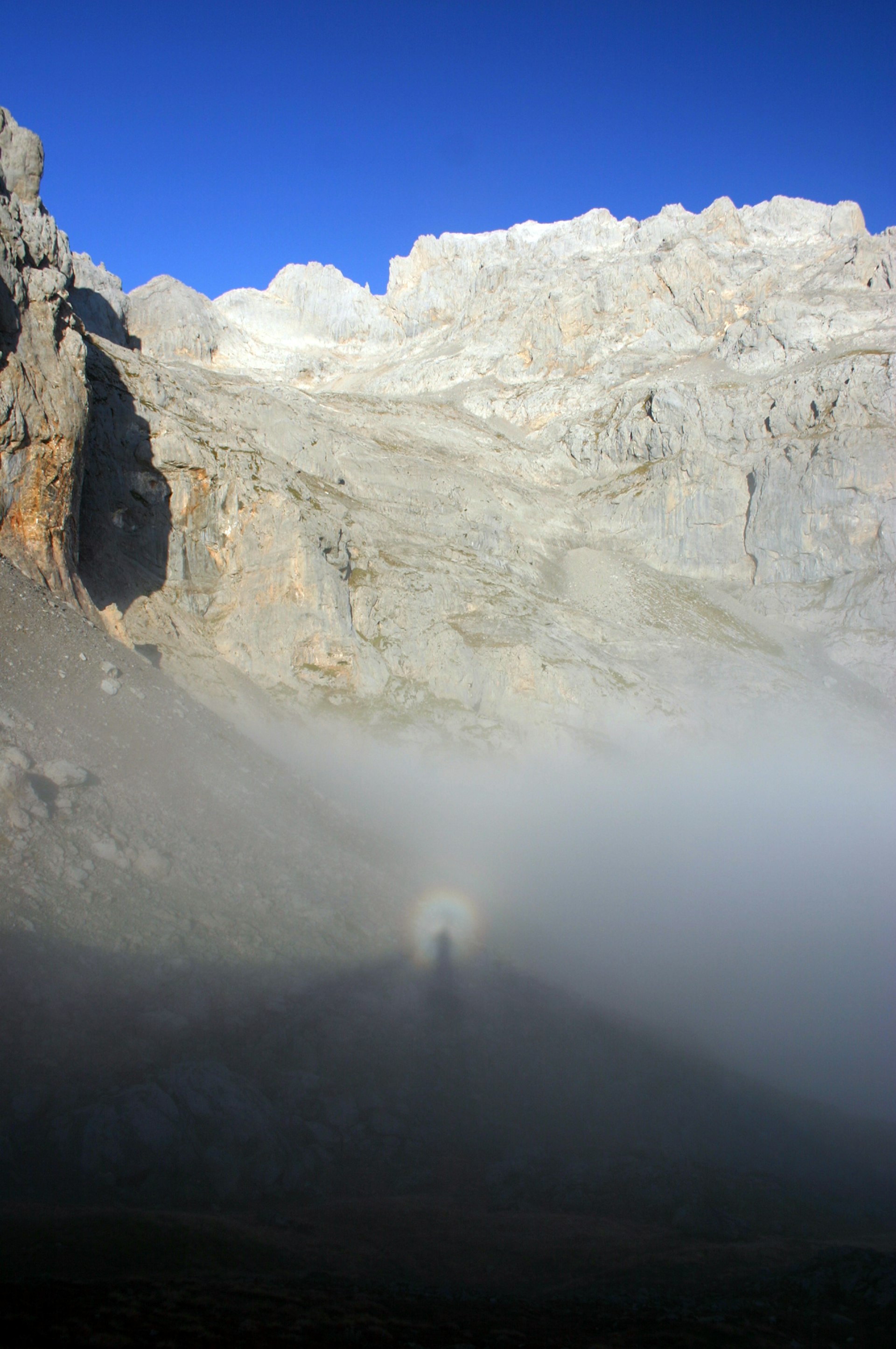 A Buddha's Halo shadow on a mountainside © William Mackesy