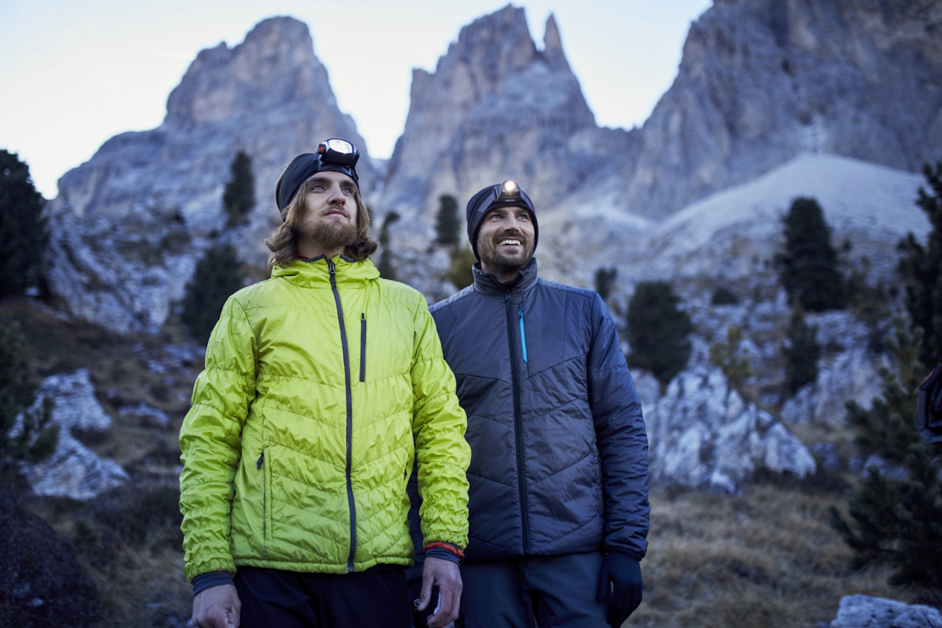 A male couple admire the view in the Dolomites.
