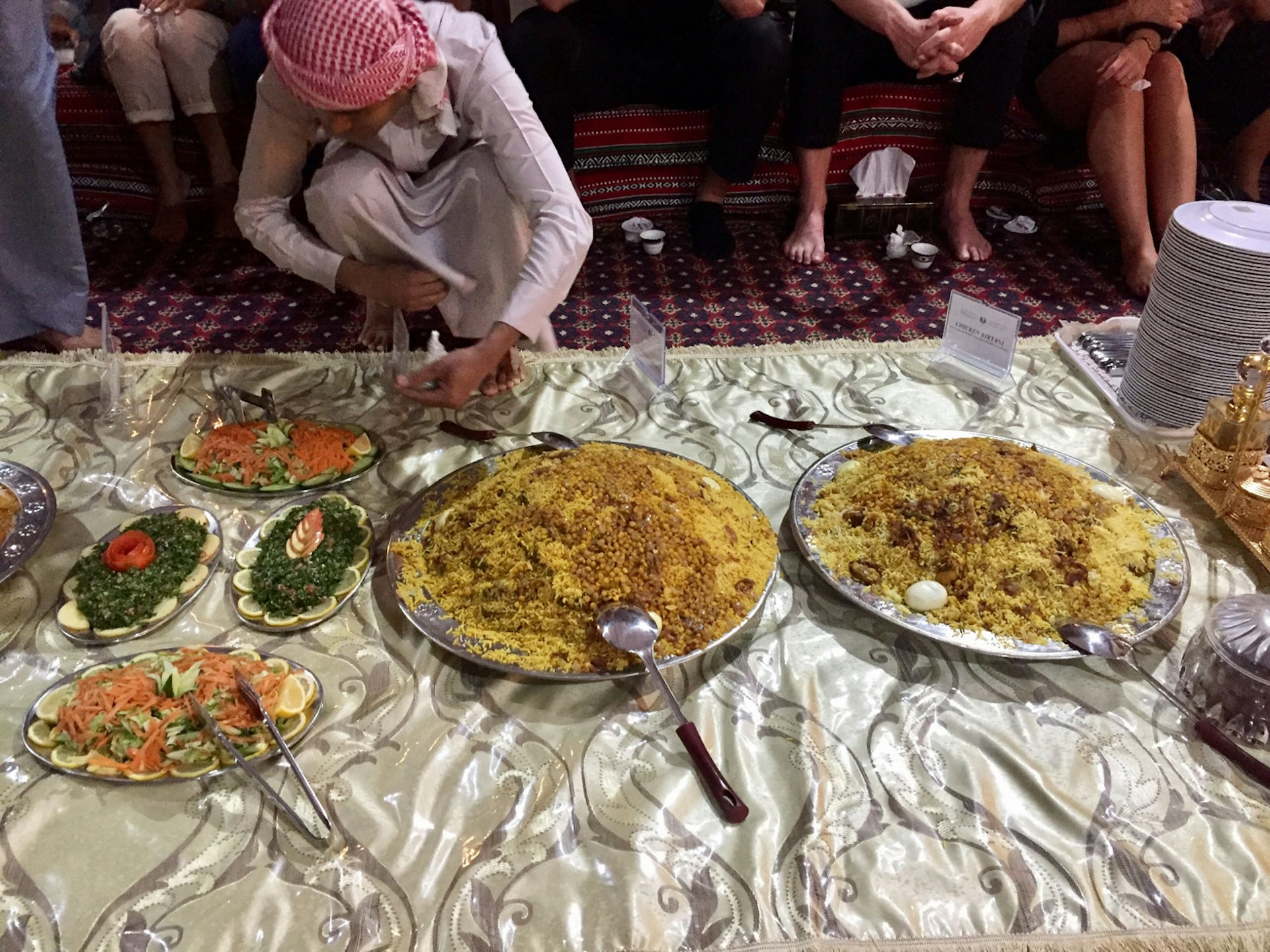 Dishes being laid out at the Sheikh Mohammed Centre for Cultural Understanding in preparation for iftar © Lauren Keith / Lonely Planet