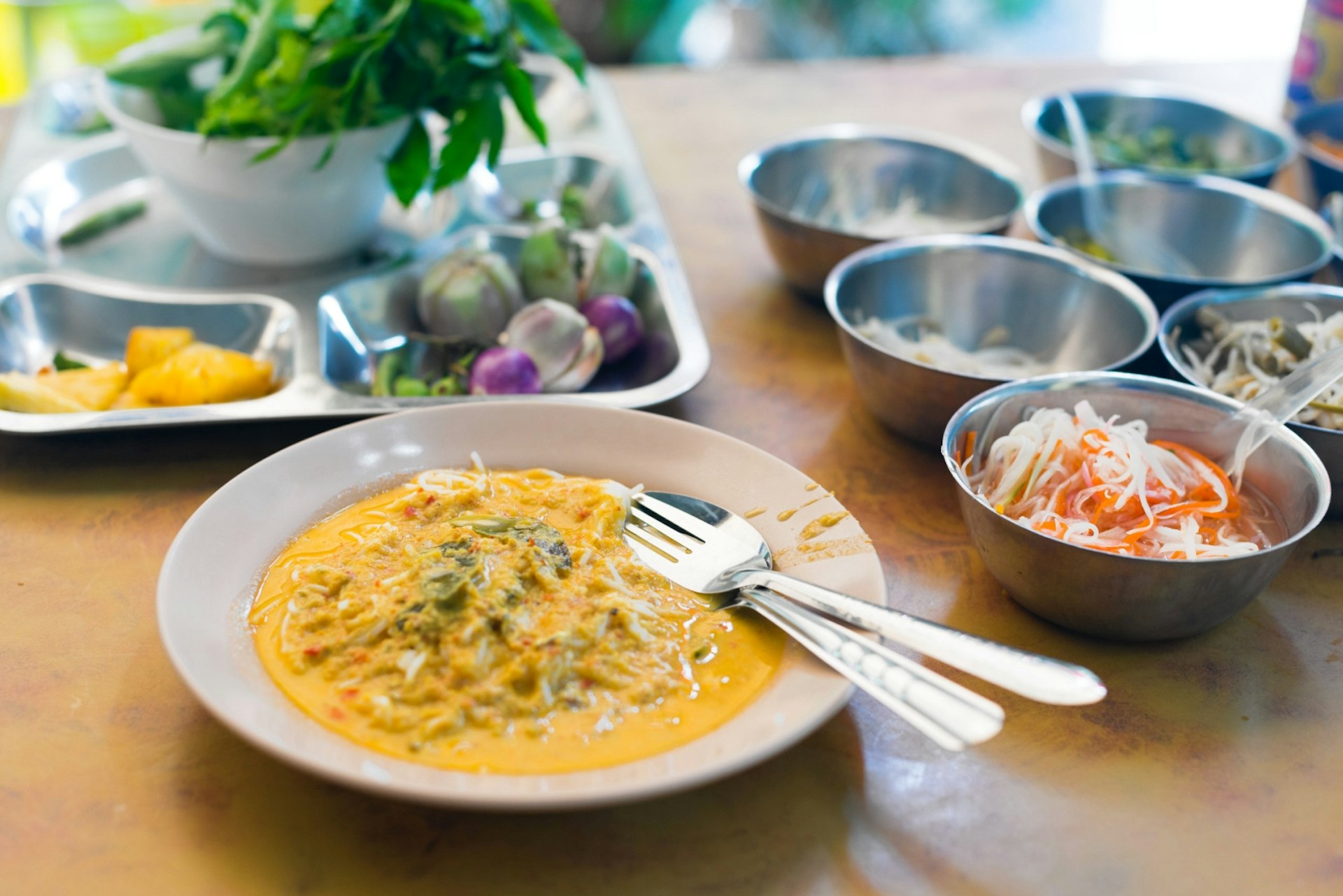 Khanom jeen, a kind of spicy seafood curry, is a typical, beloved breakfast plate in Phuket © Austin Bush / Lonely Planet