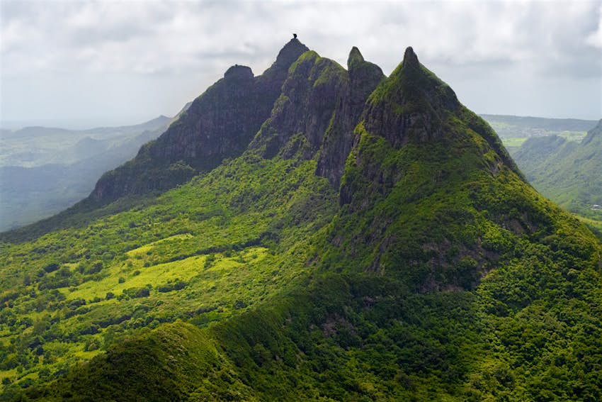 Moka mountains, Mauritius Several sharp peaks of the Moka Range in Mauritius, rise above thick green vegetation.