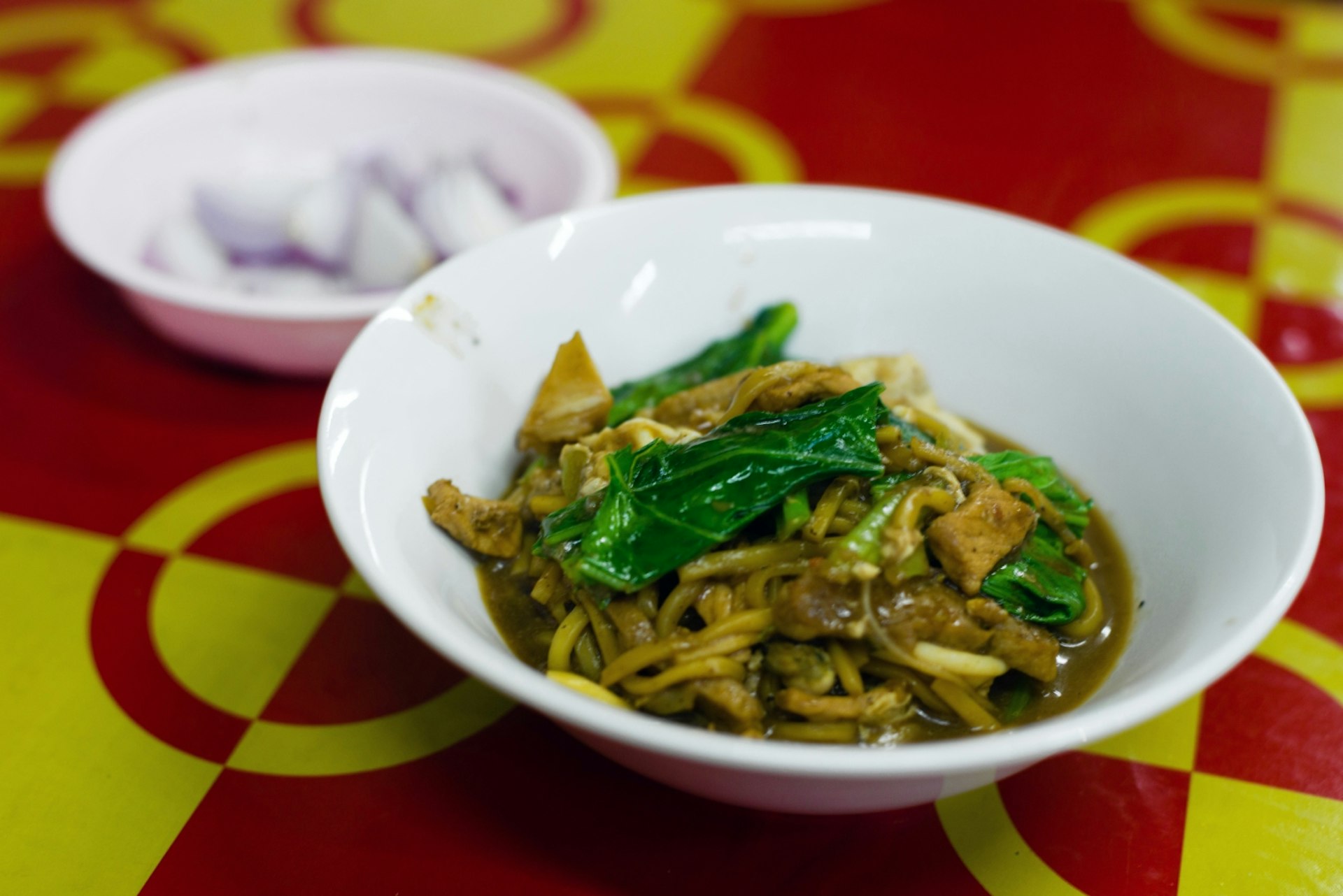 A warm bowl of savoury Mee Hokkien, a Chinese-origin dish found across Phuket © Austin Bush / Lonely Planet