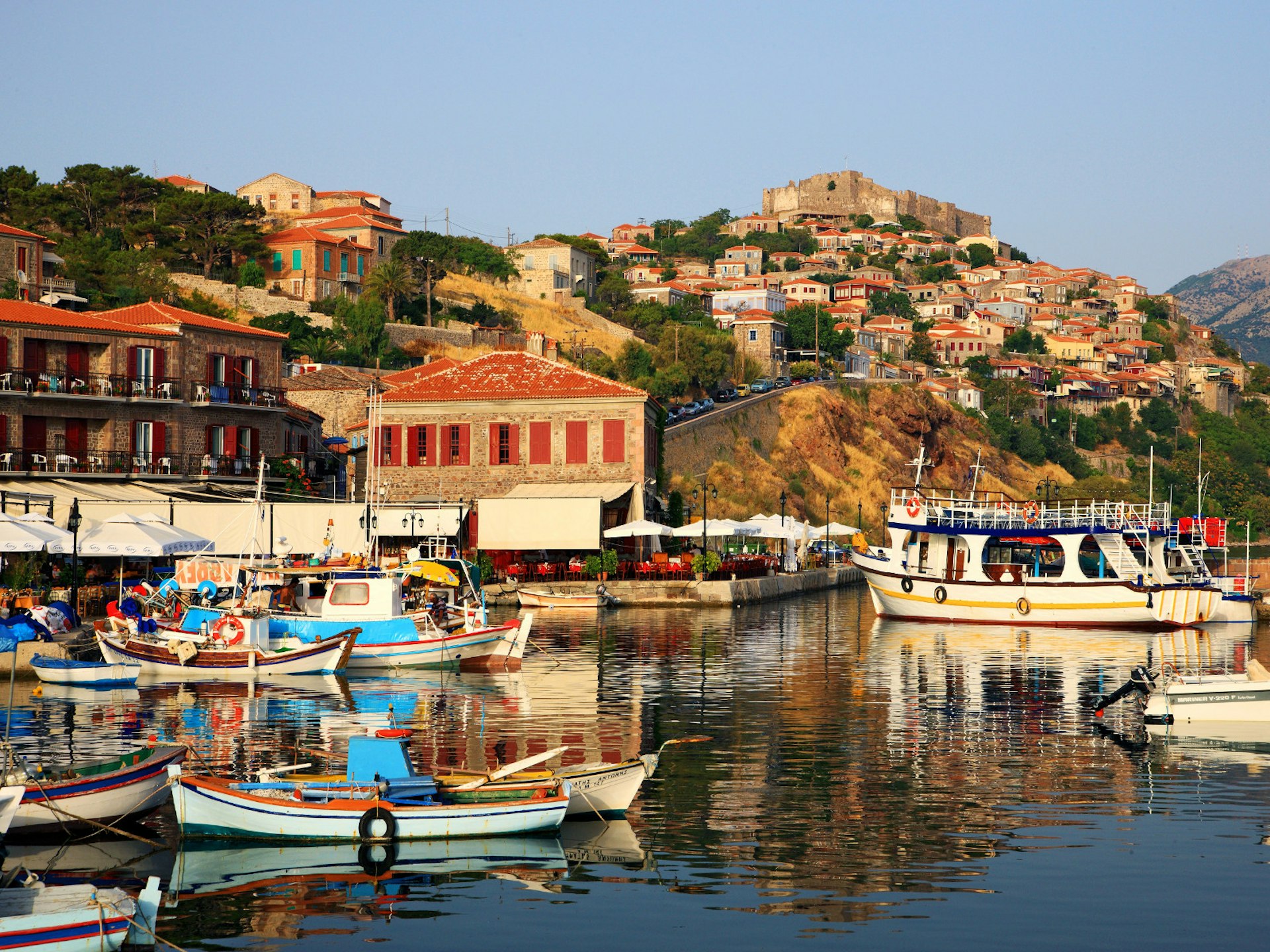 The picturesque castle-topped harbour of Molyvos (Mithymna) on Lesvos island © Heracles Kritikos / Shutterstock