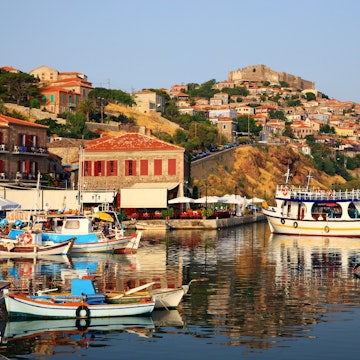 The picturesque castle-topped harbour of Molyvos (aka Mithymna) on Lesvos @ Heracles Kritikos / Shutterstock