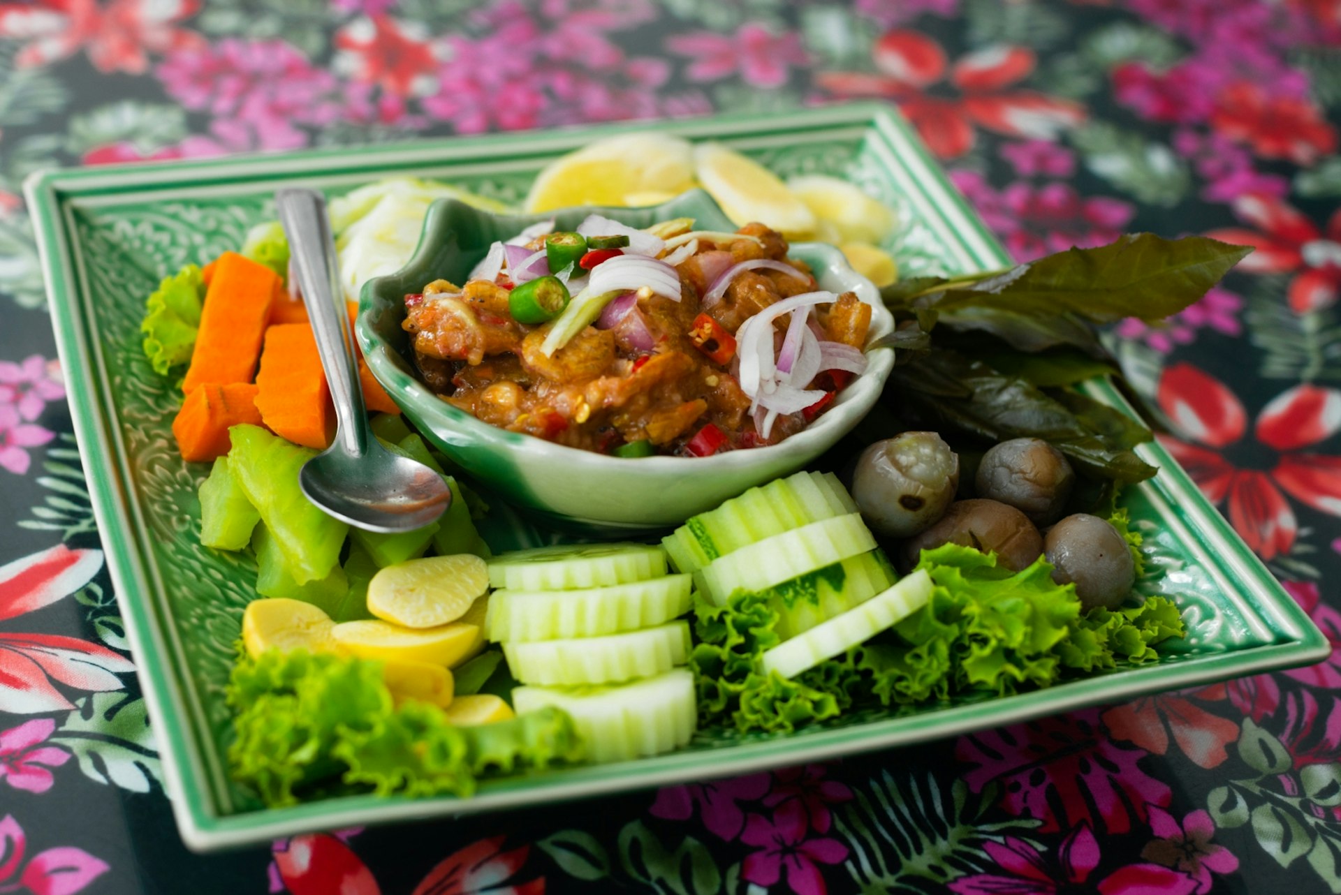 A plate of Phuket's nam prik kung siap with fresh vegetables © Austin Bush / Lonely Planet