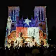 Scenes of San Antonio history, with the colors and star of the Texas flag, are projected on the front of a cathedral © Vicki Arkoff / Lonely Planet