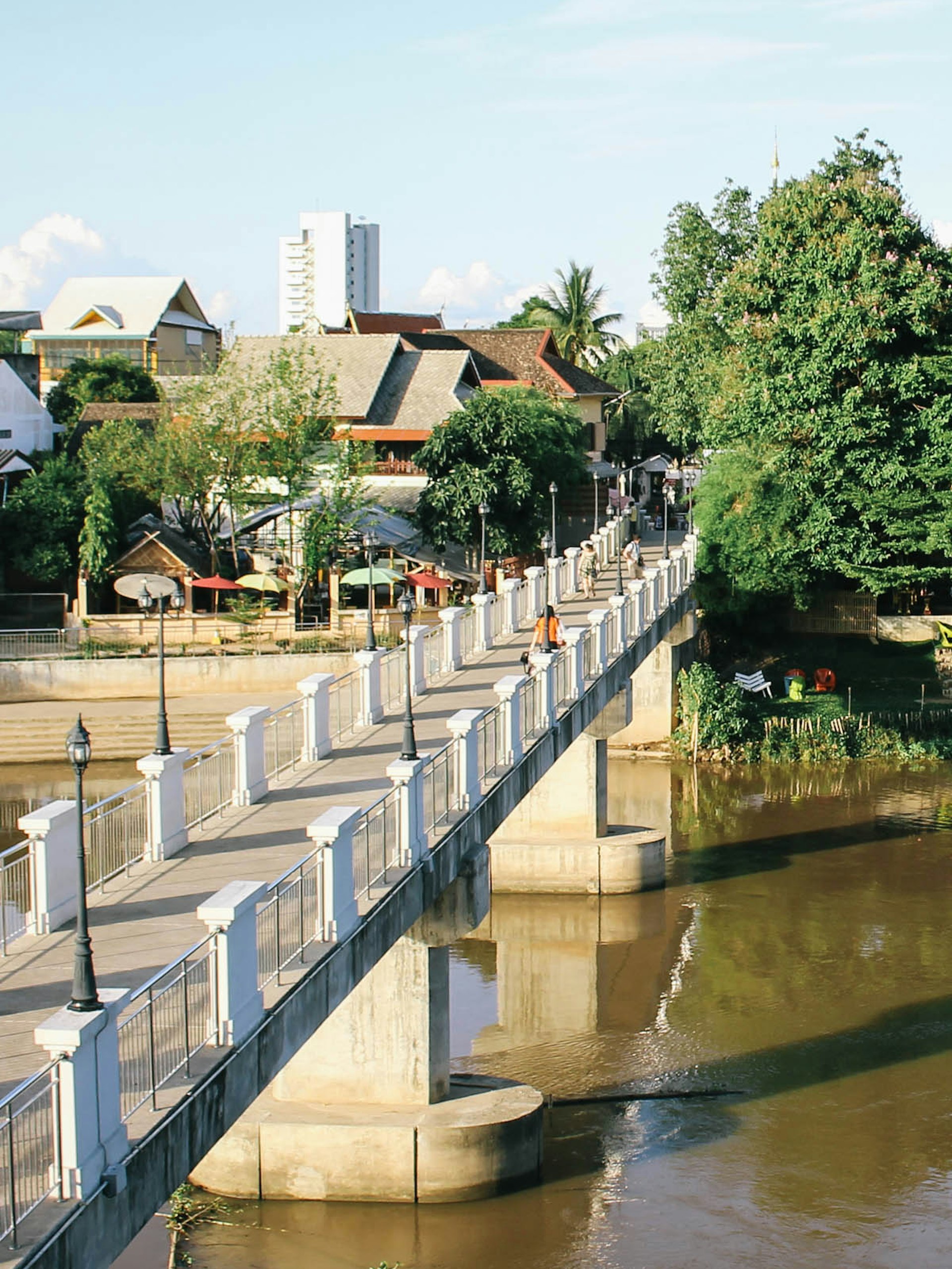 A pedestrian bridge in Wat Ket, a riverside district in Chiang Mai © Alana Morgan / Lonely Planet