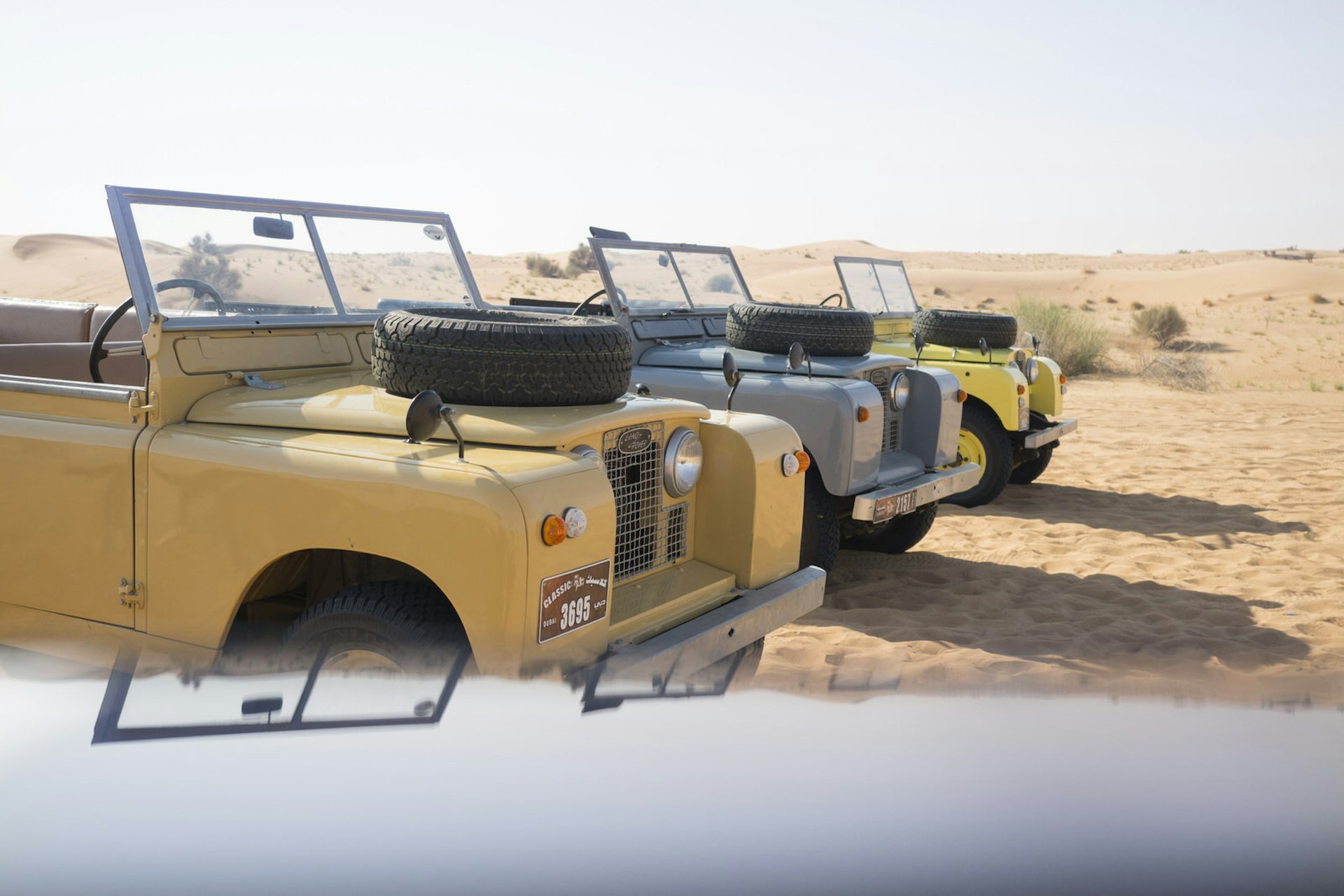 Cars line up in the Dubai desert before a hot-air balloon ride © Lisa Michele Burns / Lonely Planet